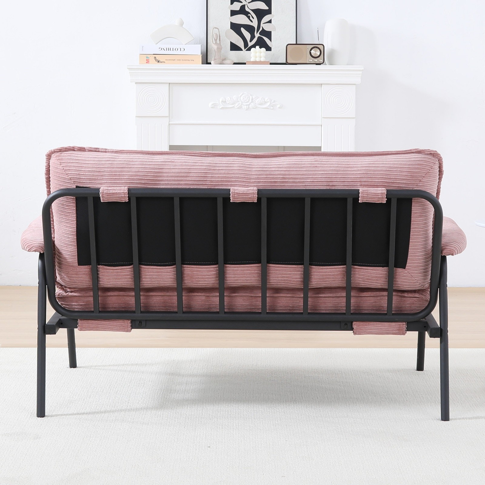 The 53-inch pink sofa offers a spacious layout in the small apartment, easily