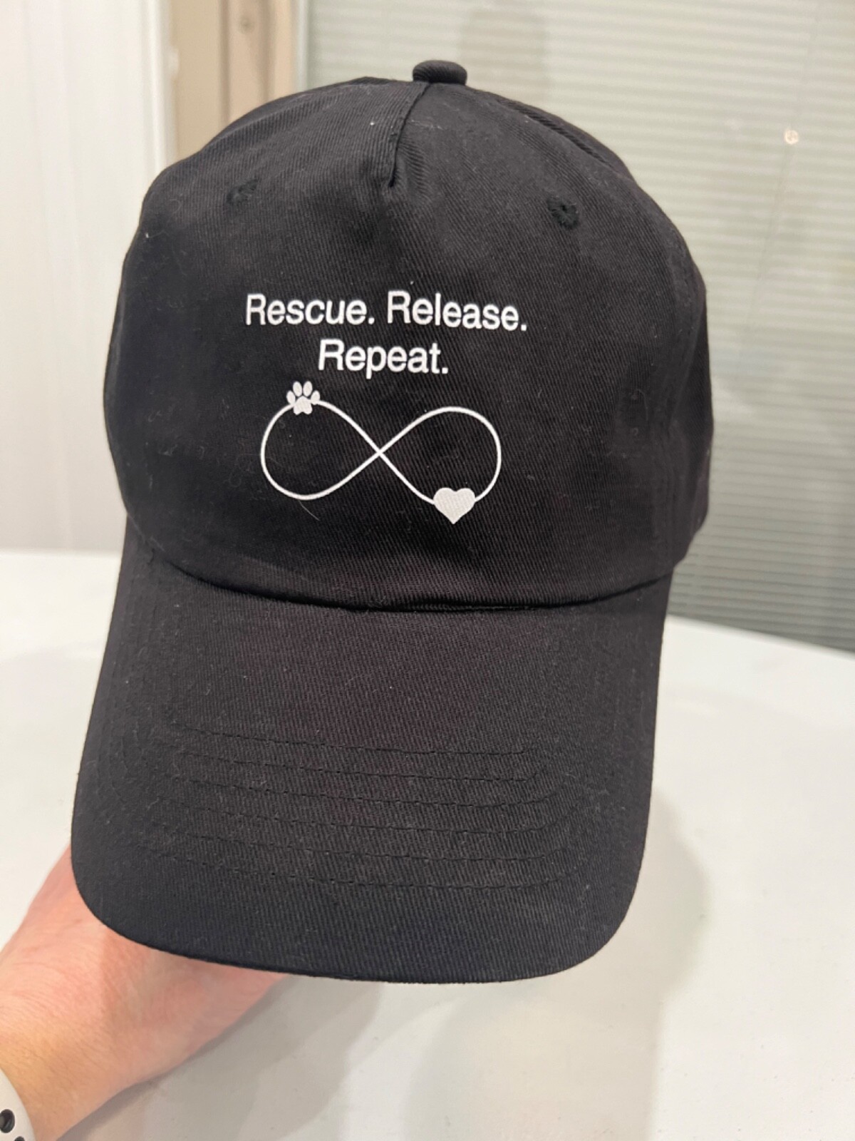 Rescue Release Repeat Black Cap Hat Hook and Loop Adj Small Paw and Heart Unique