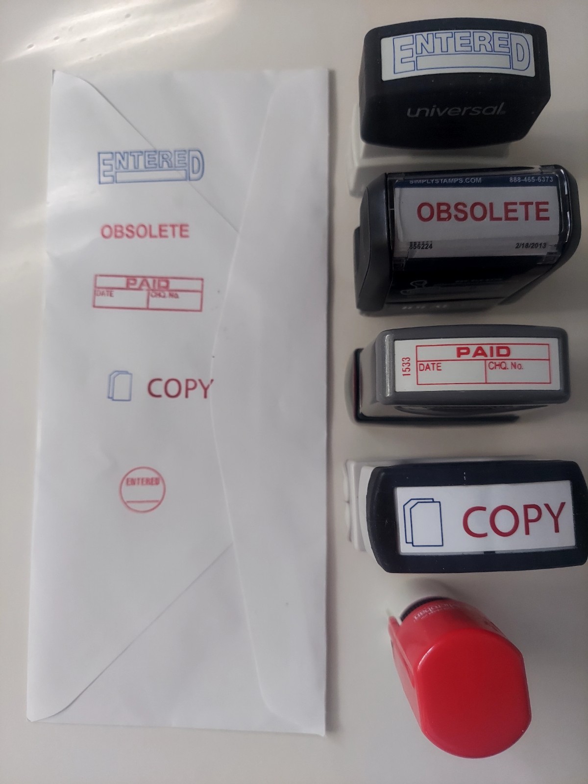 X-stamper pre-inked self-inking ENTERED OBSOLETE PAID COPY stamp ideal 4911