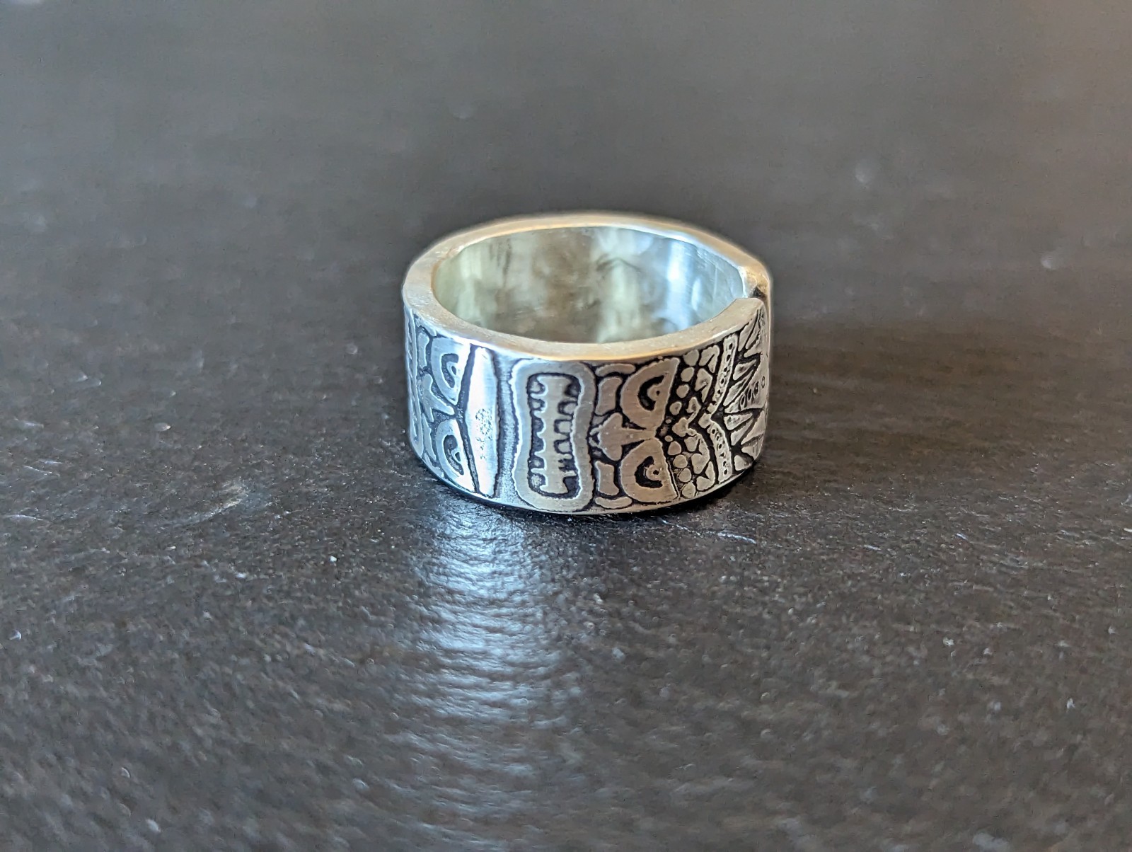 Thick sterling silver ring with tiki gods - handmade - open design