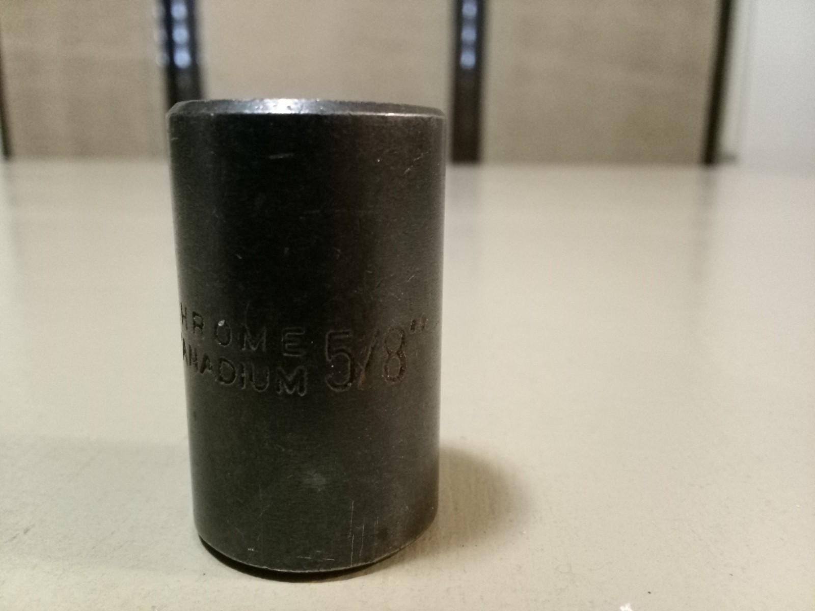Vintage Chrome Vanadium 1/2" drive 5/8" 6 pt black socket. Gently used.