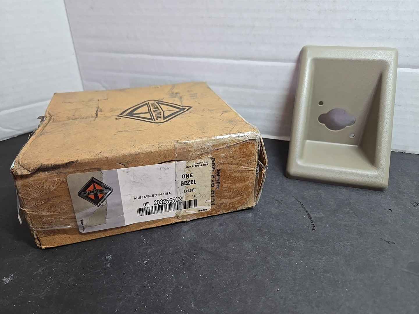 NOS International 2032565C2 Headlamp Bezel Trim Lugg Door Release