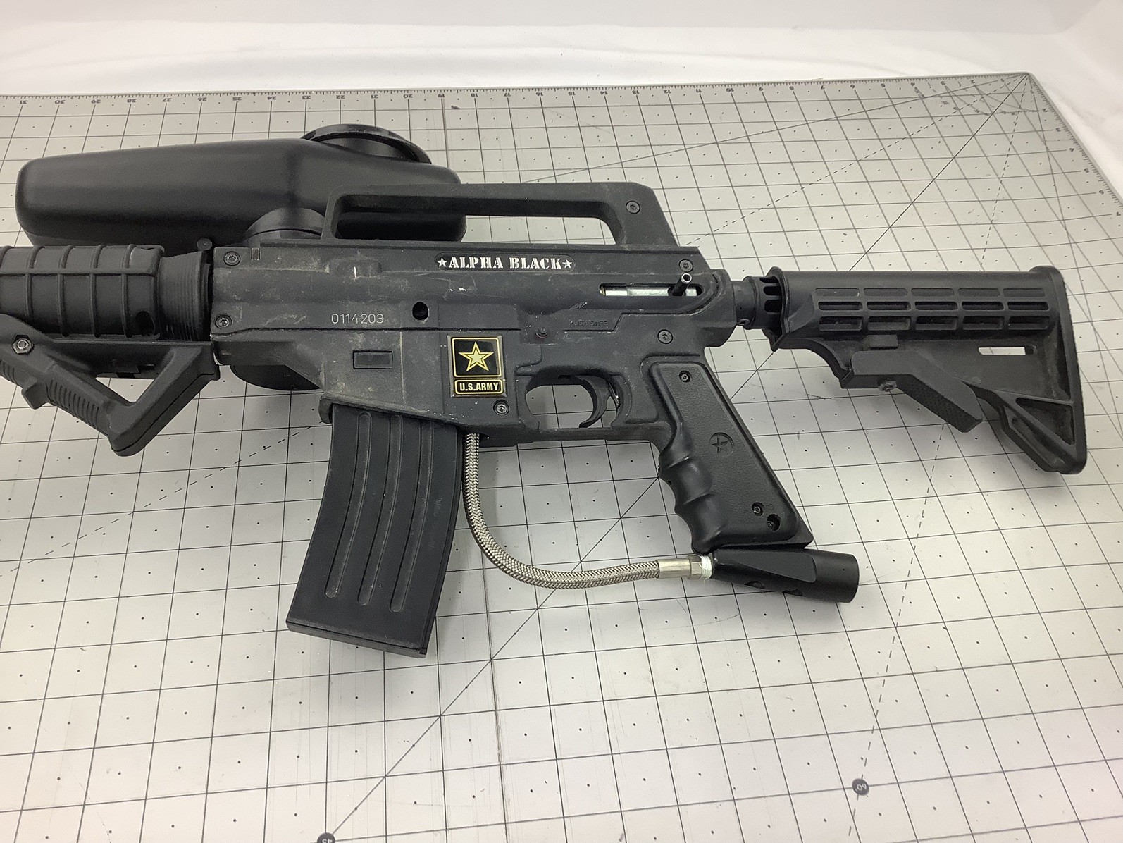 Tippmann Alpha black paintball marker with e trigger and cyclone feed untested