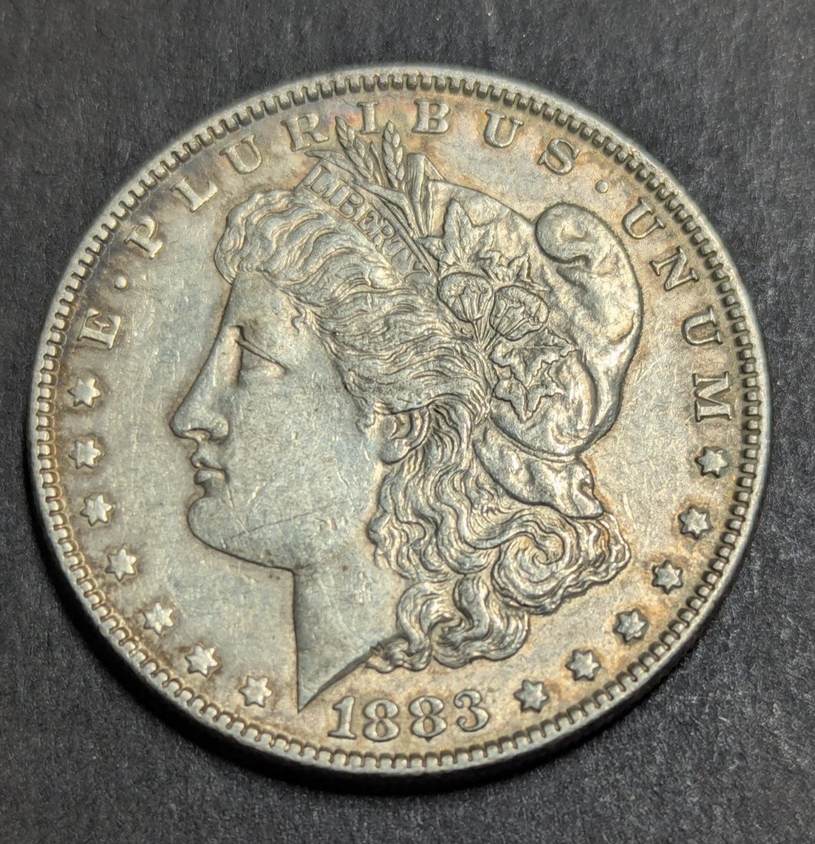 1883 Philadelphia Morgan Silver Dollar 90% Silver. Fine To Very Fine