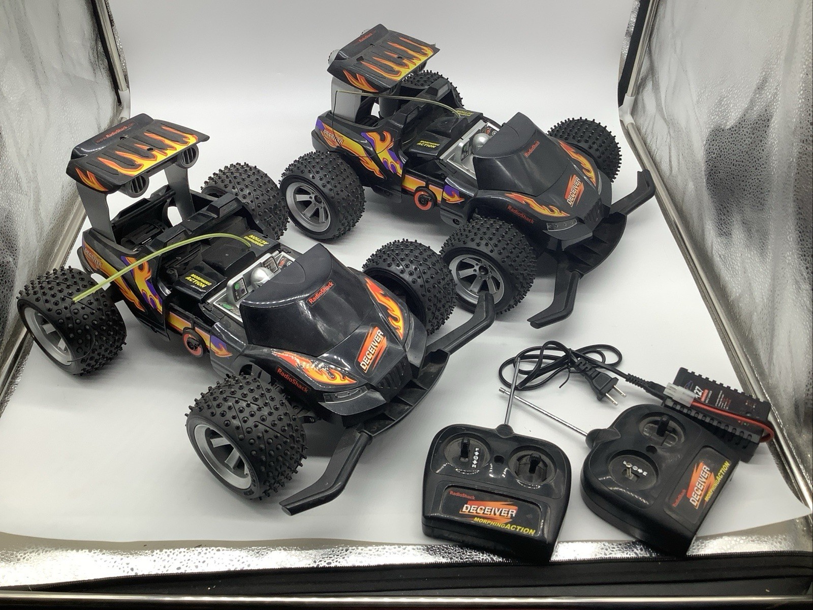 2 Vintage Radio Shack Deceiver Morphing Action RC Cars With Remotes & Charger