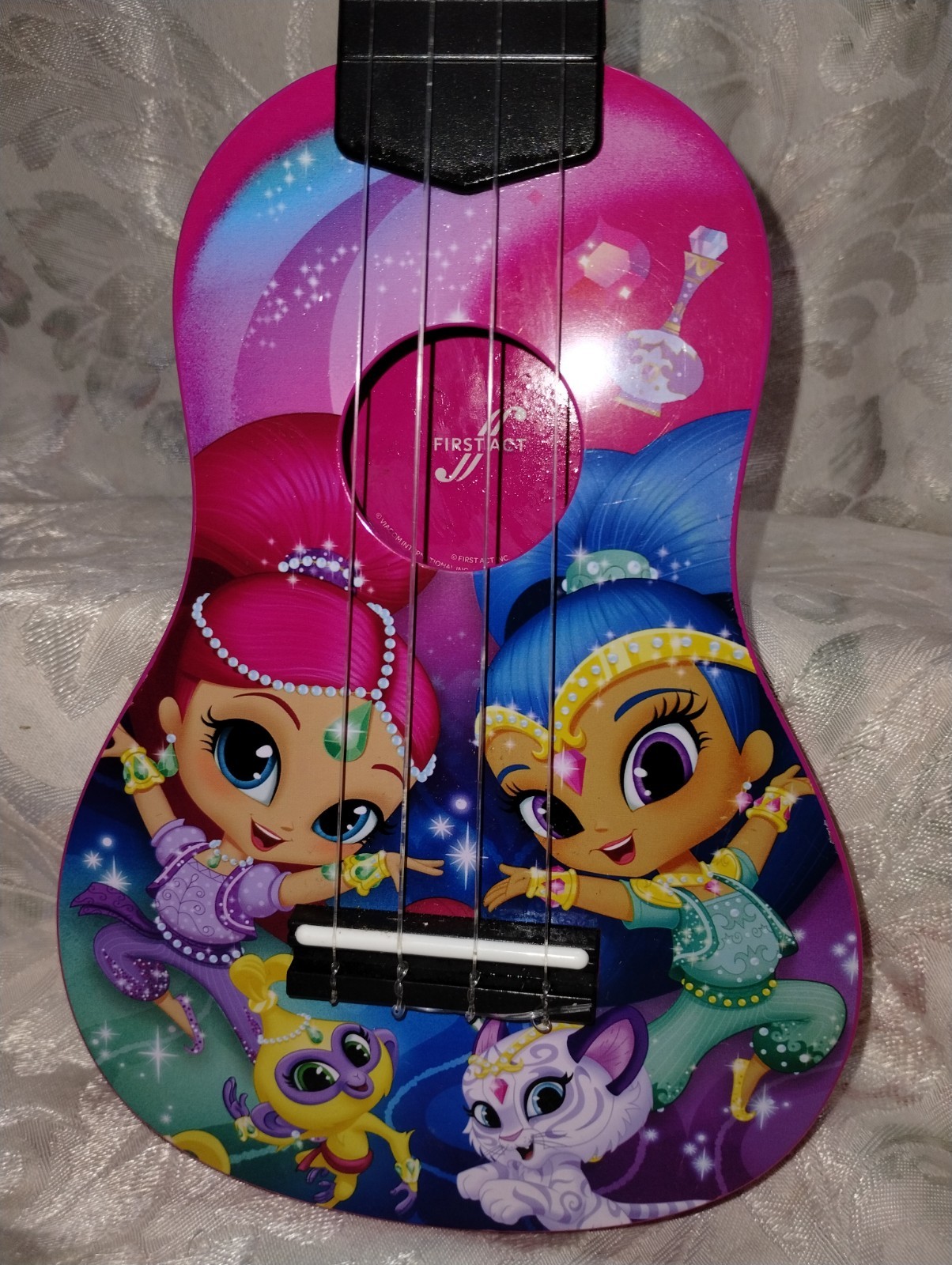 First Act Discovery Shimmer and Shine soprano toy ukulele.