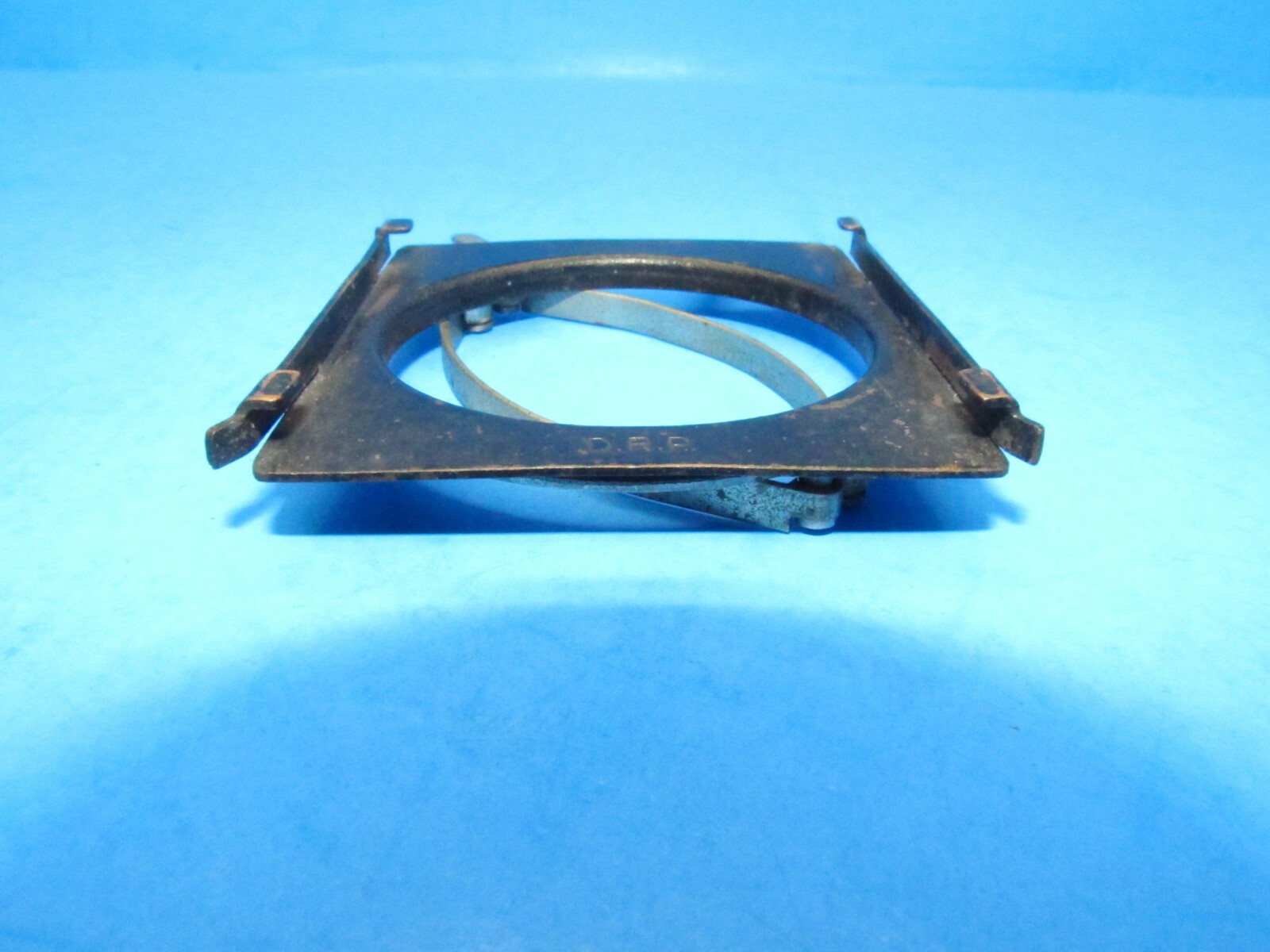unique small filter holder marked RHACO DRP GERMANY attaches w/ spring clamps