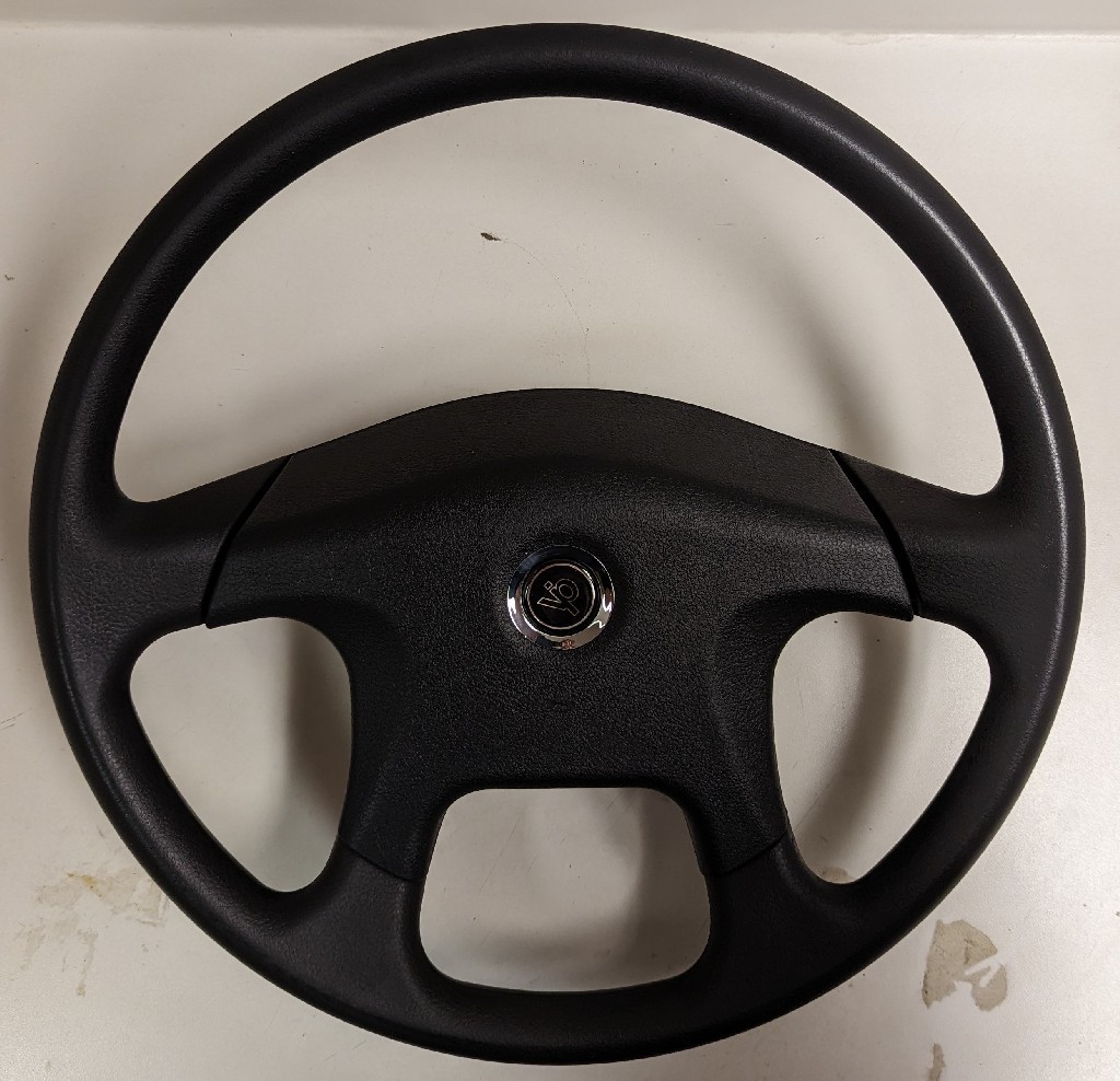 KENWORTH 18" BLACK MOLDED POLYURETHANE, 4 SPOKE, VIP BLK H.B.