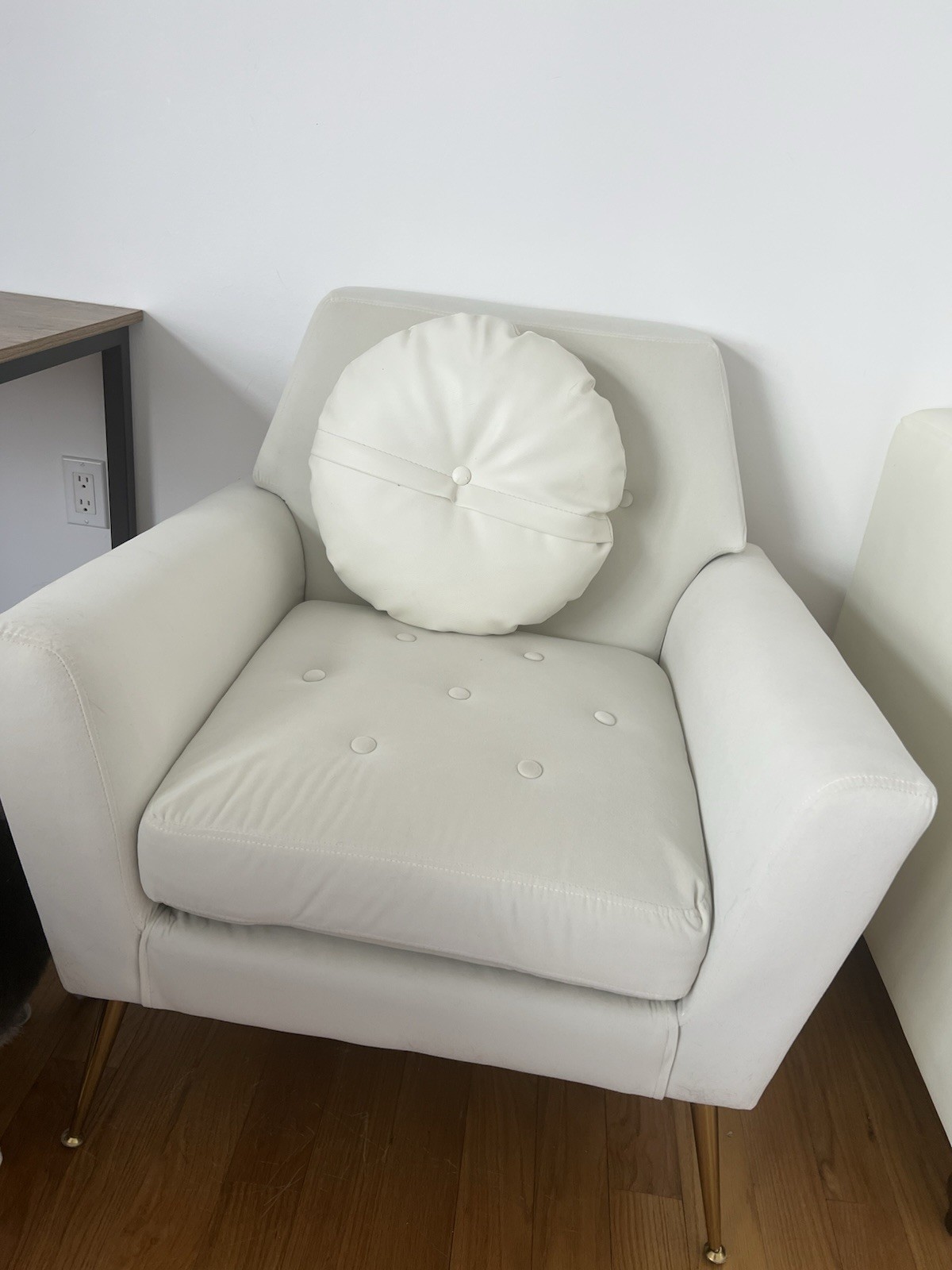 White quilted fabric armchair