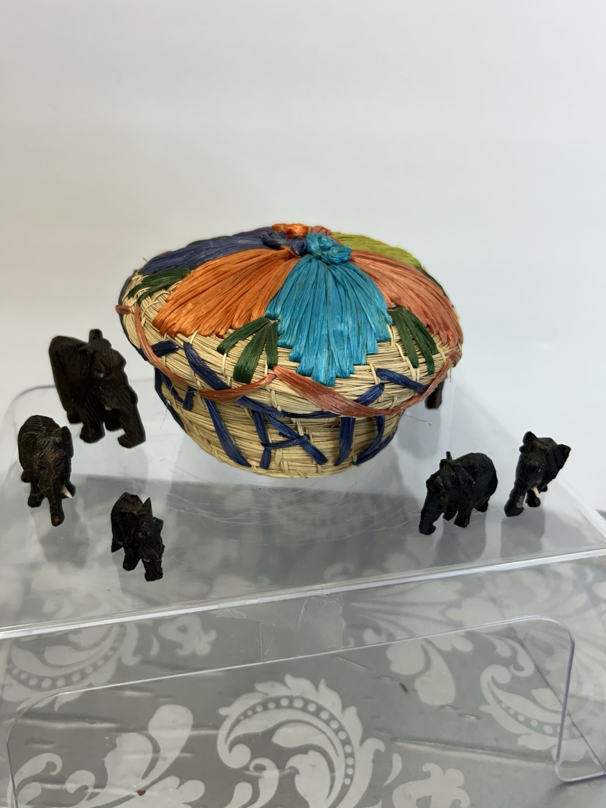 Jamaica Basket With 6 Wooden Elephants. Some Tusk Are Missing