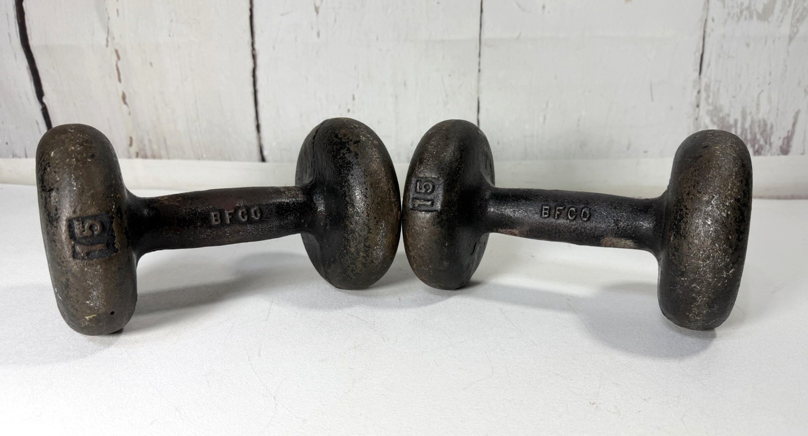 VINTAGE BFCO PAIR 15LBS EA (30LBS TOTAL) CAST IRON BUN STYLE DUMBBELLS