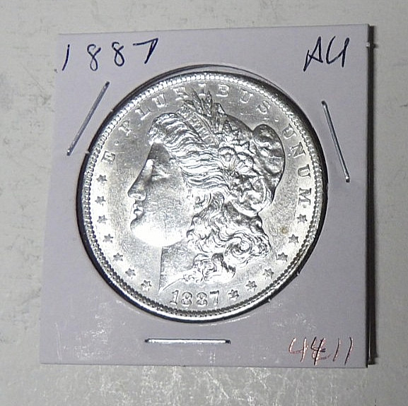 AU 1887-P Morgan Silver Dollar Cleaned About Uncirculated Philadelphia (102523)