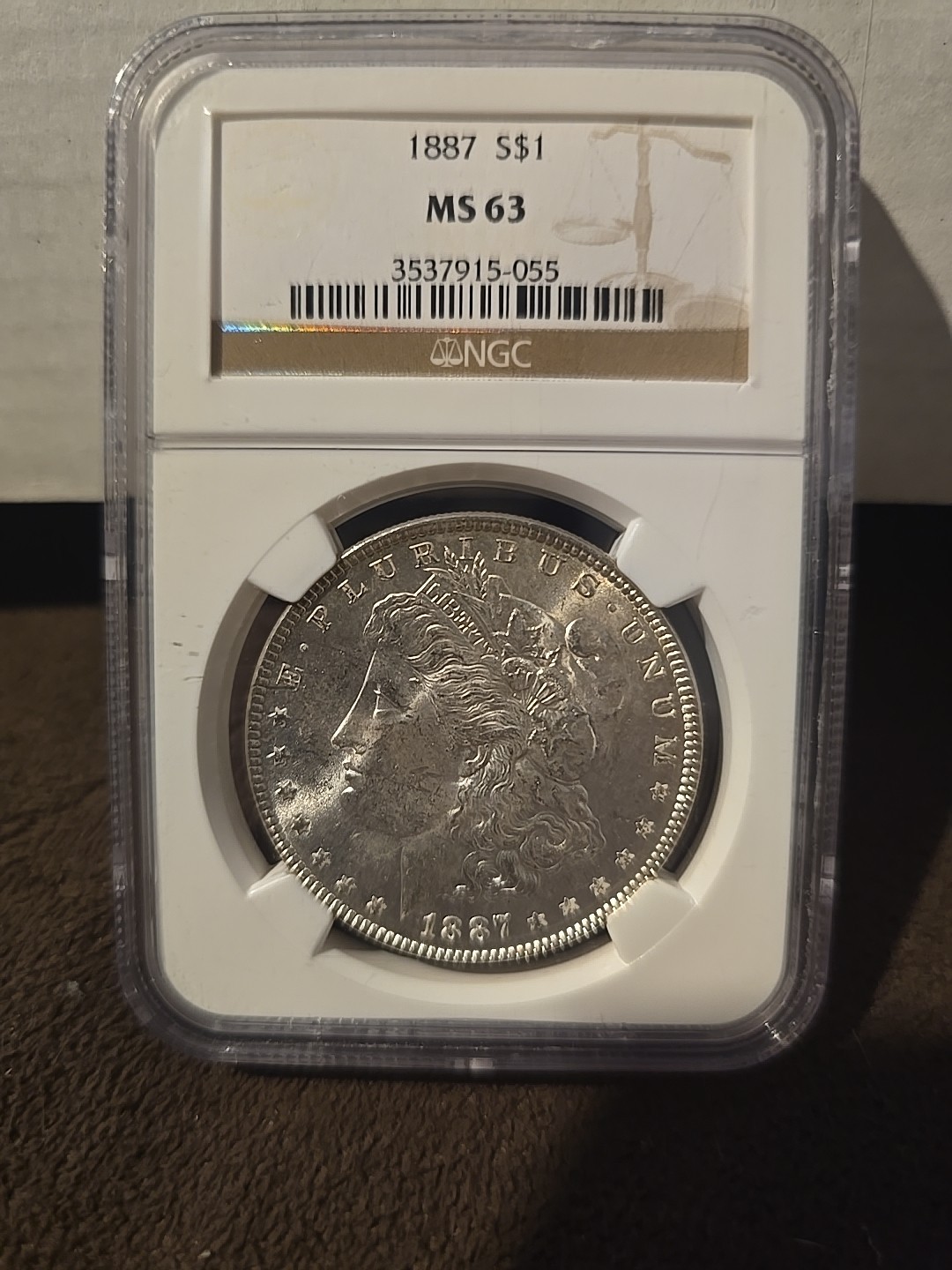 1887- S$1 Morgan Silver Dollar - Has Some Toning- NGC MS63