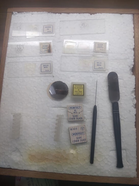 Small microscope kit with tools, slides, and case
