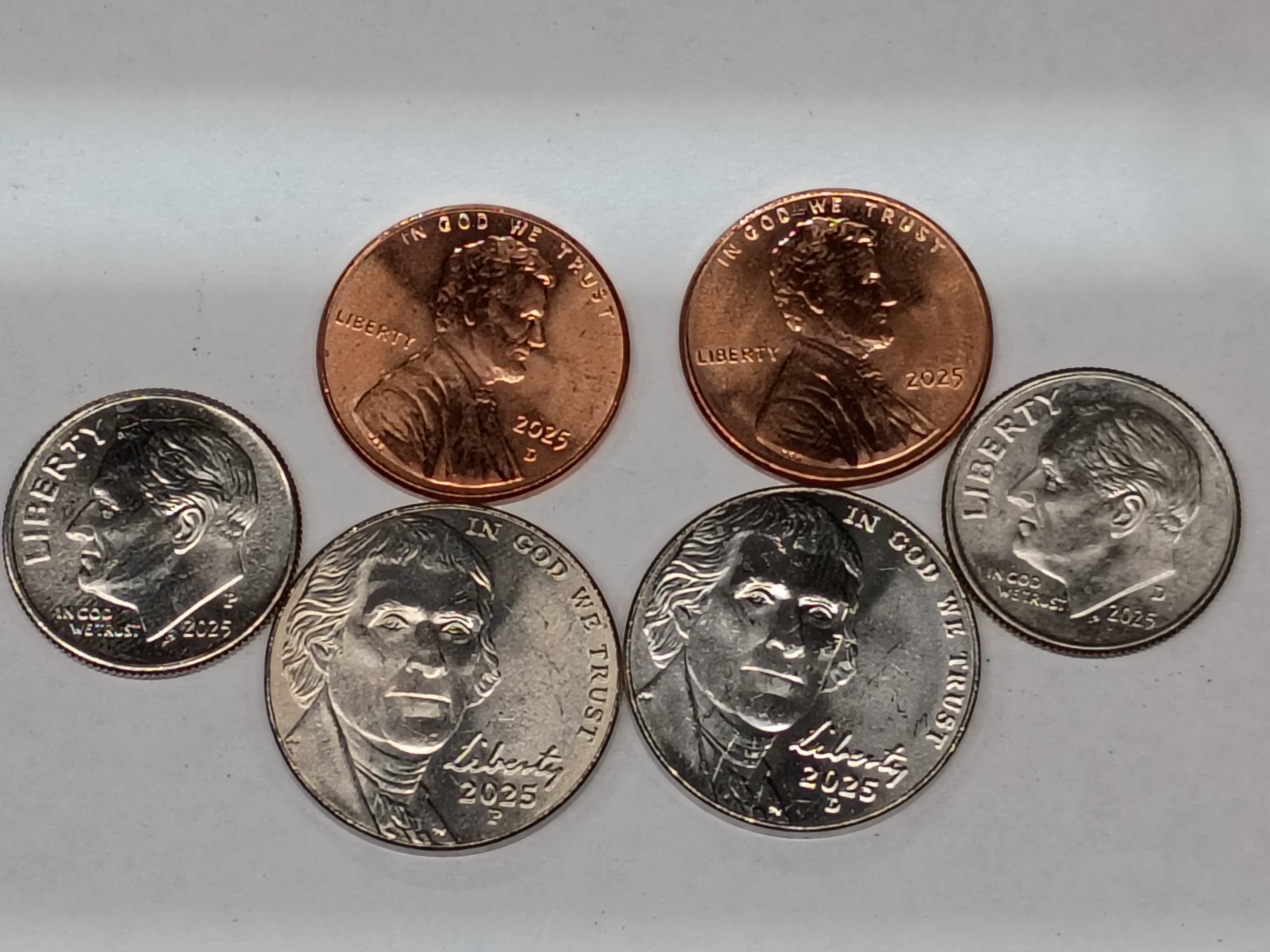 set of 2025 pennies nickels and dimes in high grades.