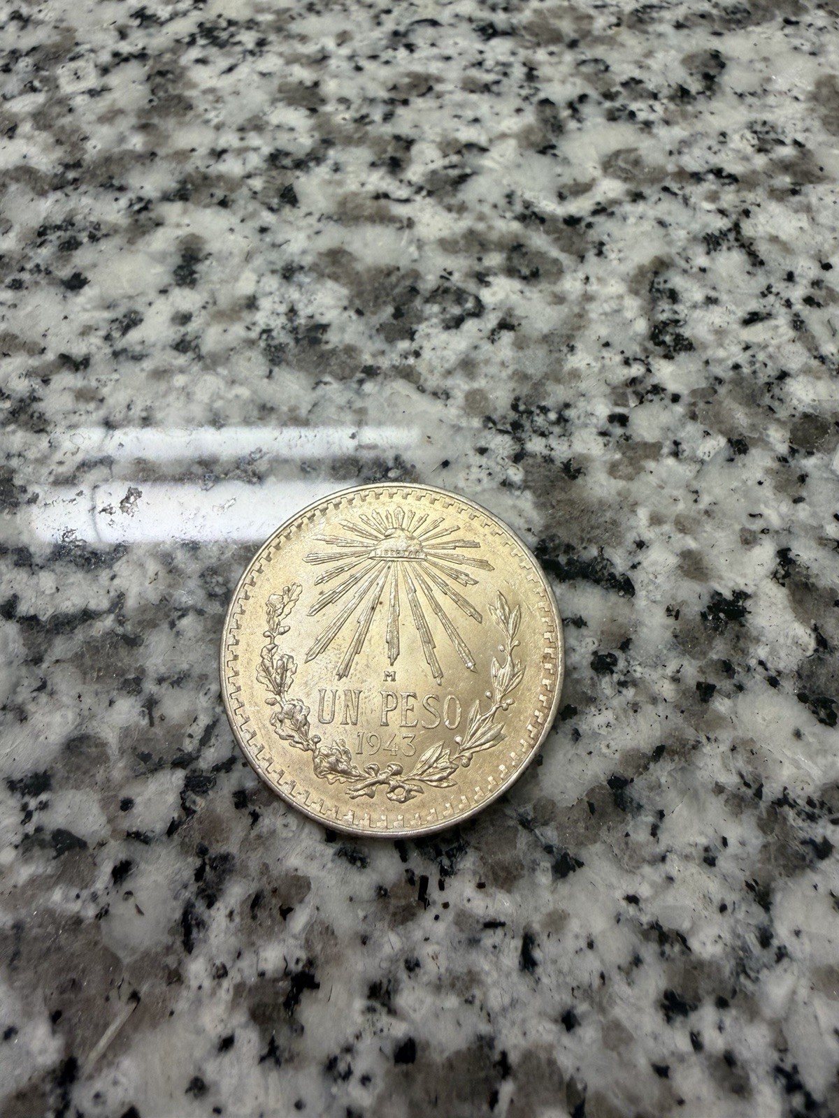 1943 un peso and 1939 50 centavos