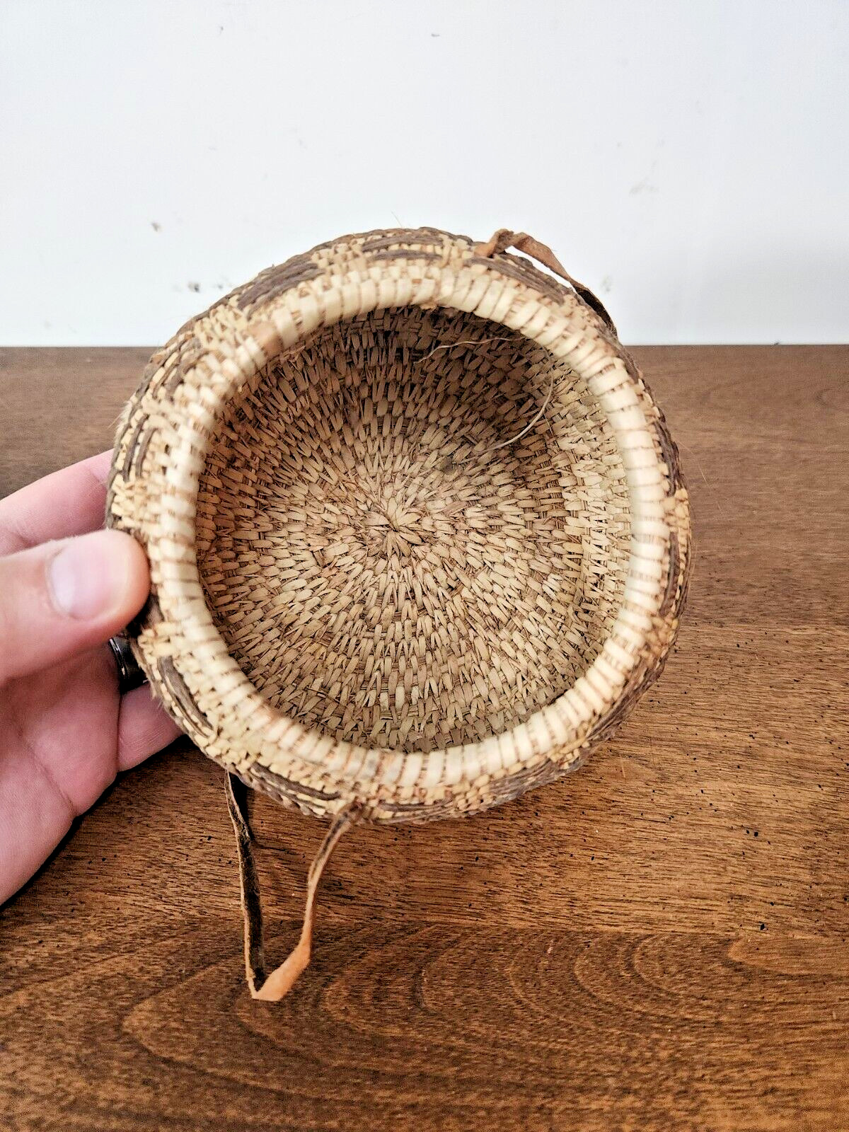 ANTIQUE OMANI BEDOUIN WOVEN LIDDED BASKET WITH LEATHER