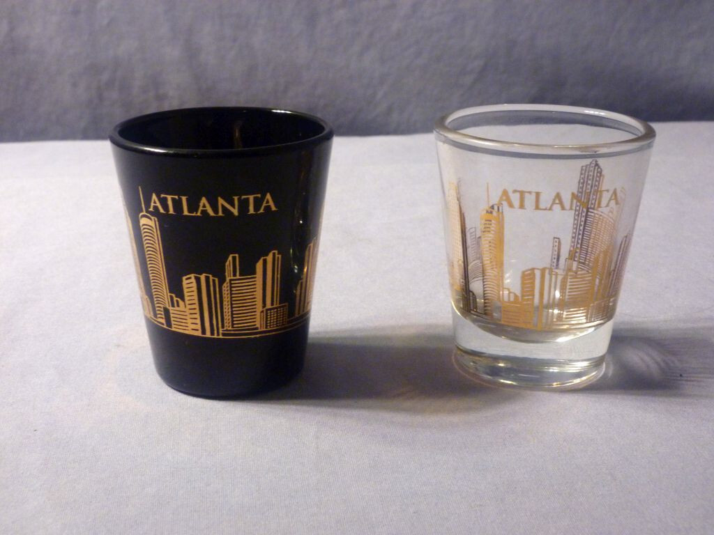 2 Atlanta Skyline Shot Glasses - one black, one clear, gold print