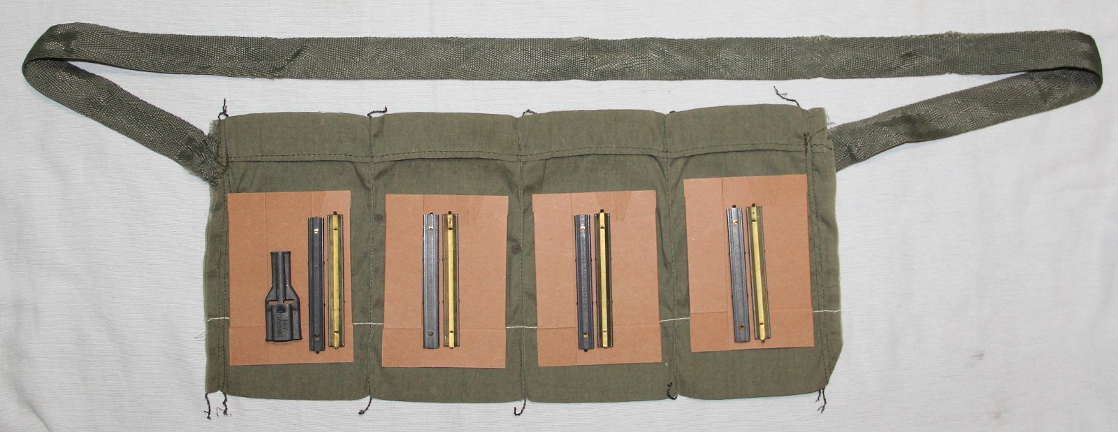 ORIGINAL 1991 5.56 BANDOLEER W/ CARDBOARD INSERTS, STRIPPER CLIPS AND CHARGER