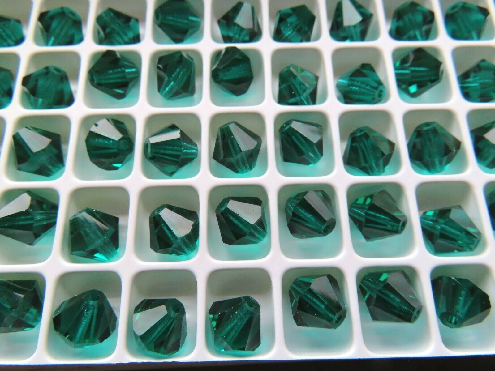 36 Preciosa crystal bicone beads in 8mm Emerald color.