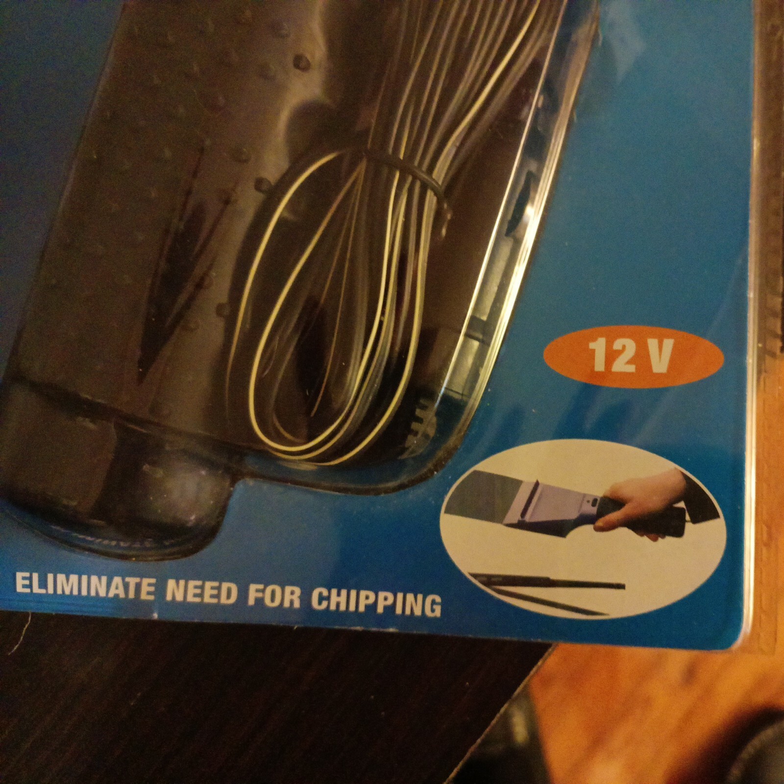 Heated Ice Scraper Rapidly Dislodges Ice Cream Windshield Nip