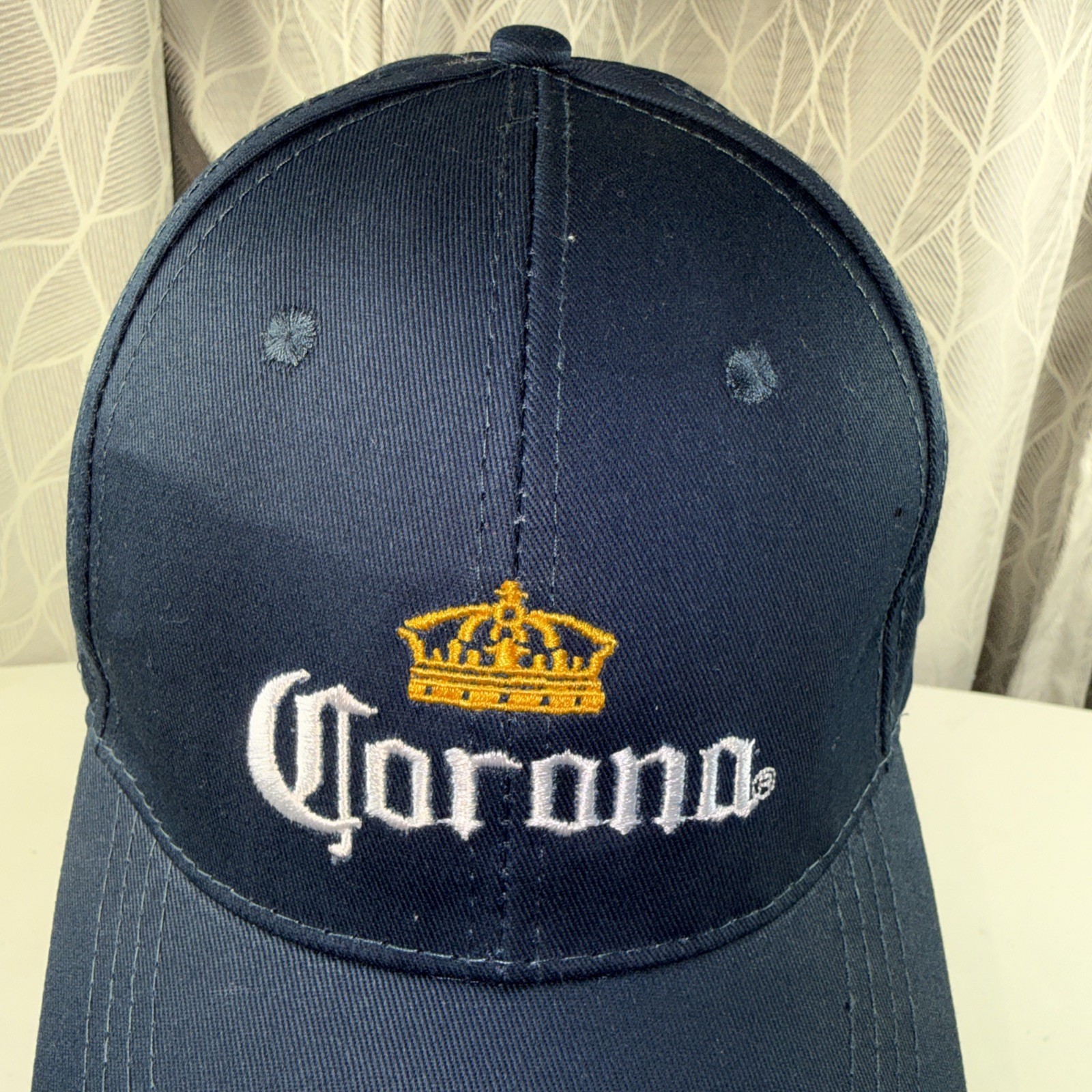 Corona in White Letters w Gold Crown on Navy Hat Cap Hook Loop