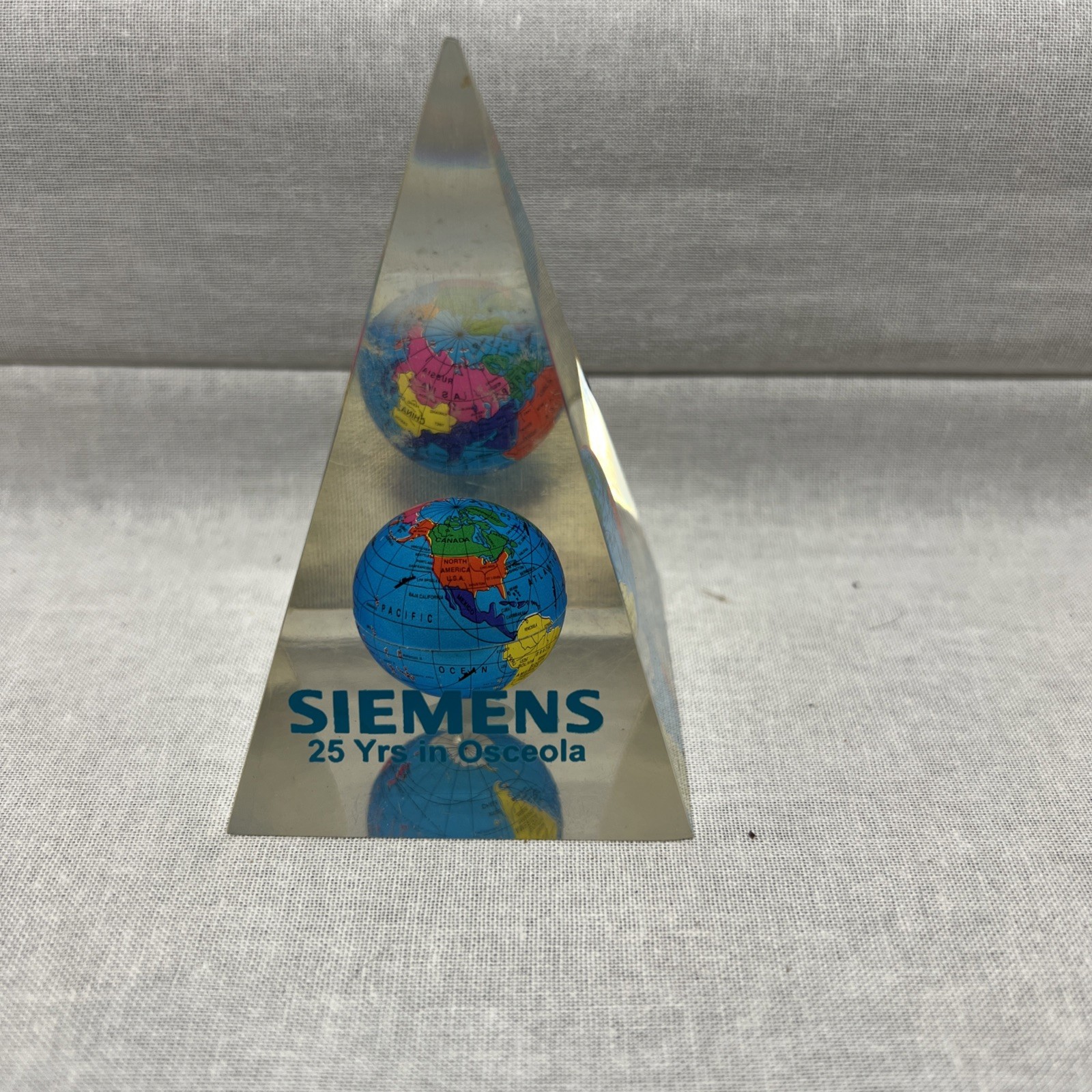 Globe inside Clear Pyramid Paperweight Siemens 25 Years In Osceola