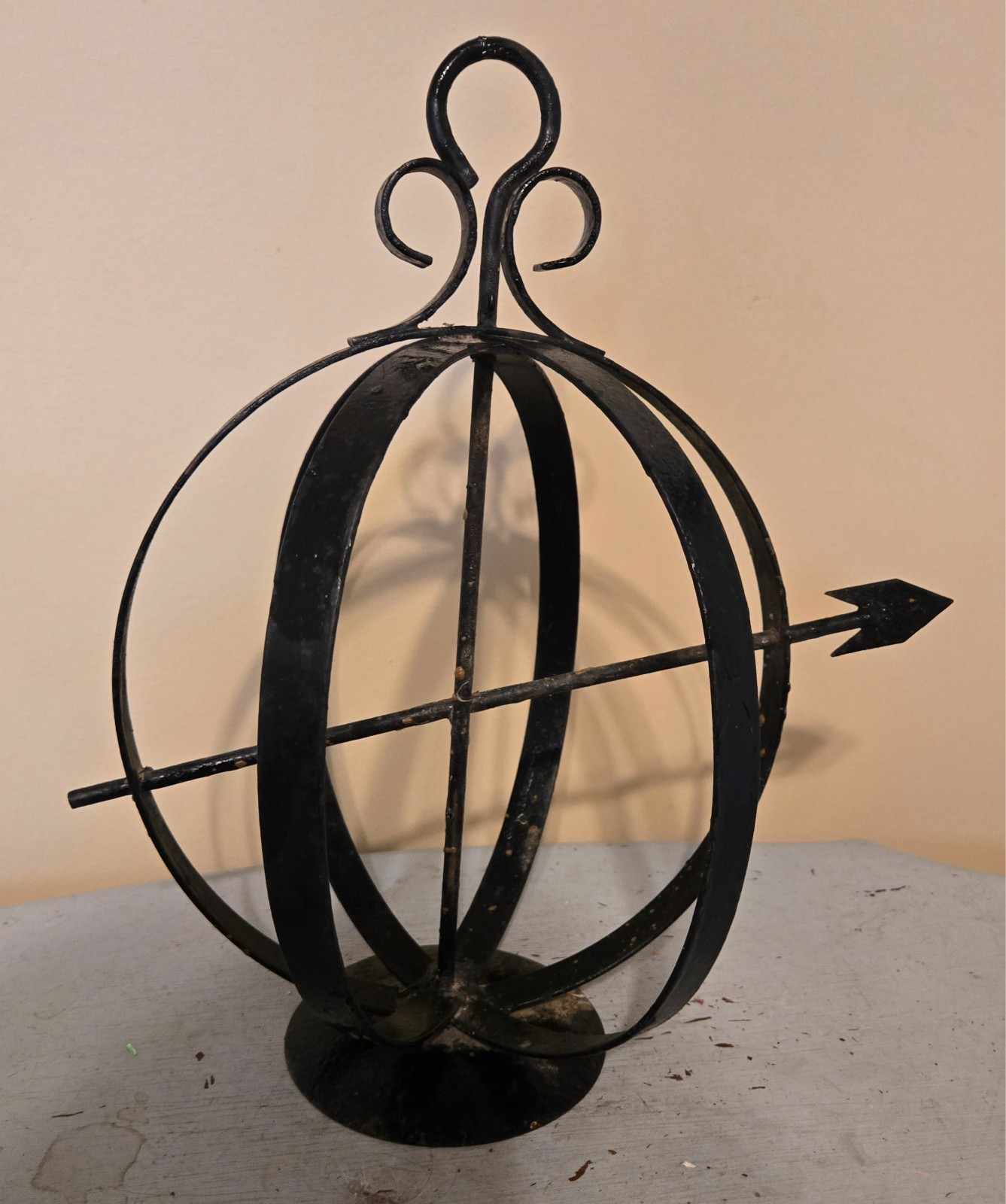 Vintage black metal sphere used for outside or inside