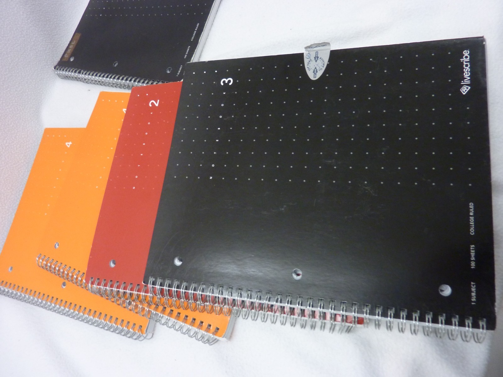 FOUR LIVESCRIBE NOTEBOOKS - COMPLETE PLUS ONE PARTIAL LIVESCRIBE NOTEBOOK