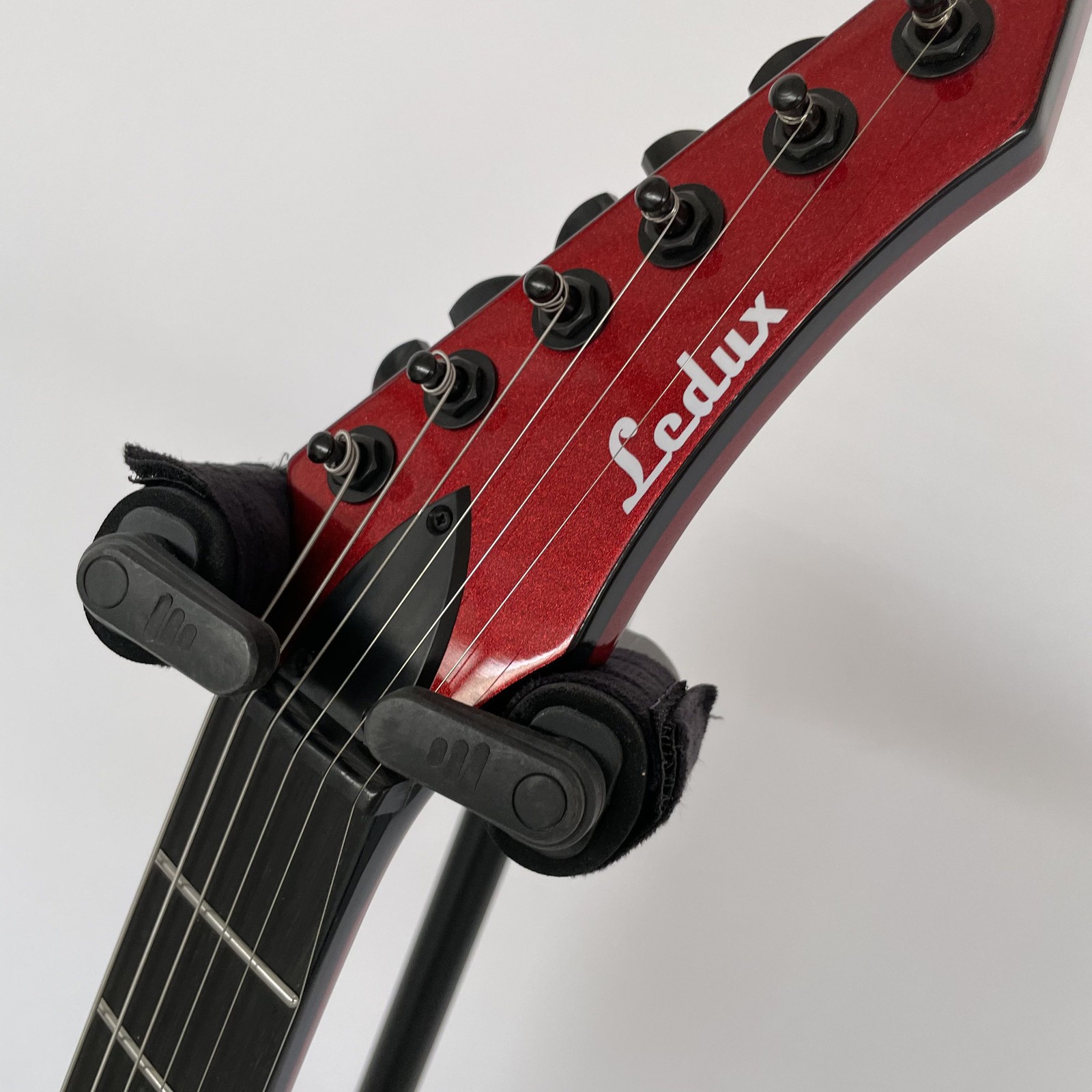 Ledux Solid Body Electric Guitar Rounded Fret Fixed Bridge Red top black binding