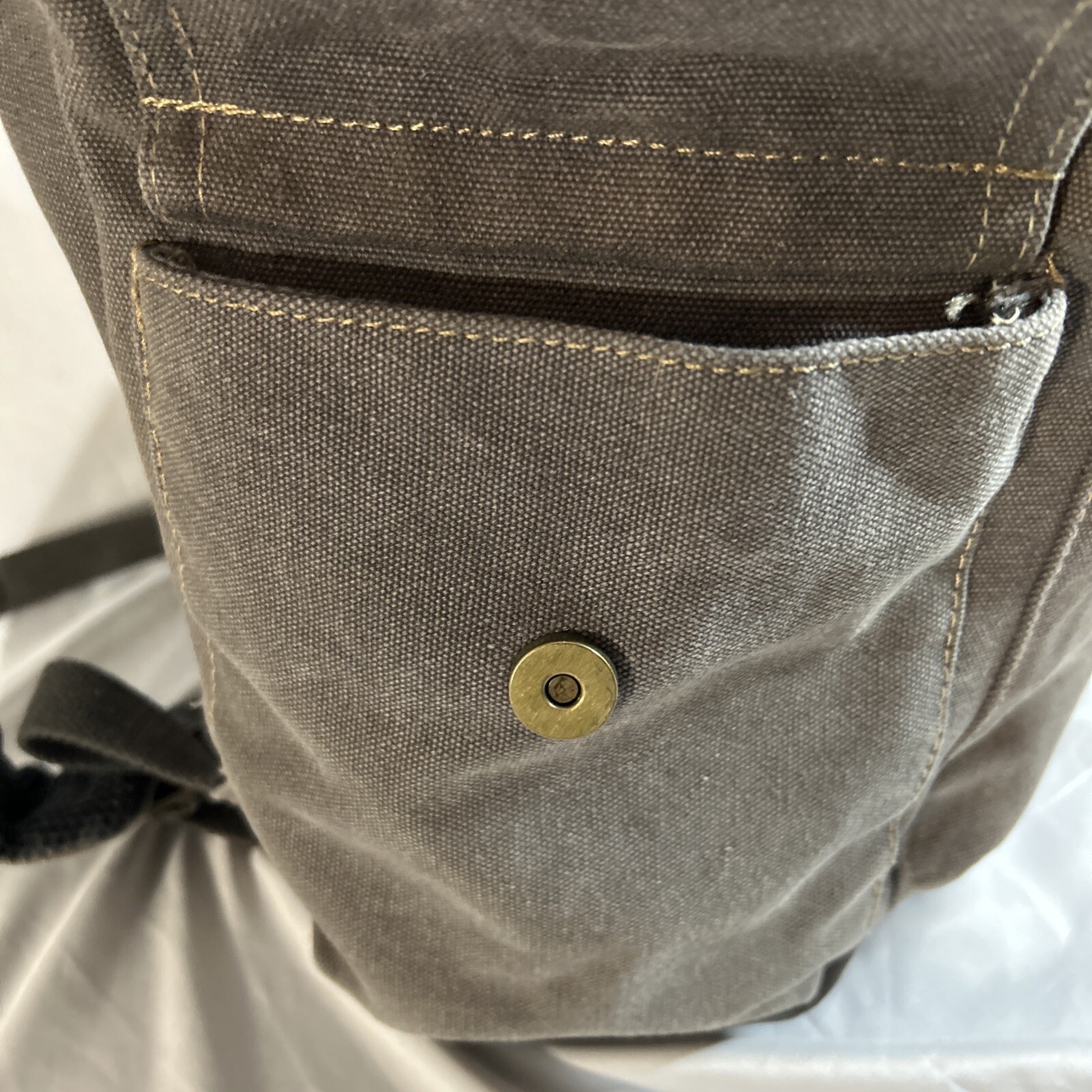 Cargoit Gray Canvas Backpack Magnetic Closures Pockets Straps and A Deep Inside
