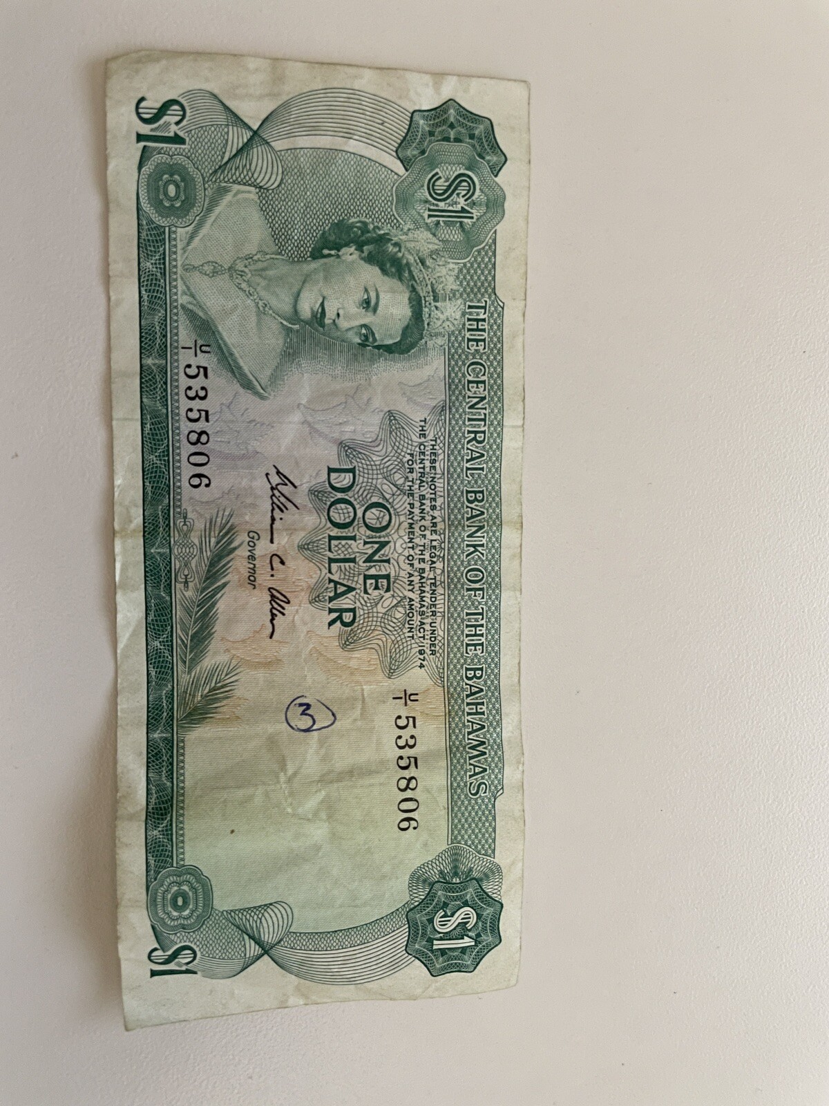 1974 Bahamas 1 One Dollar - used. One written ink mark on front of bill.