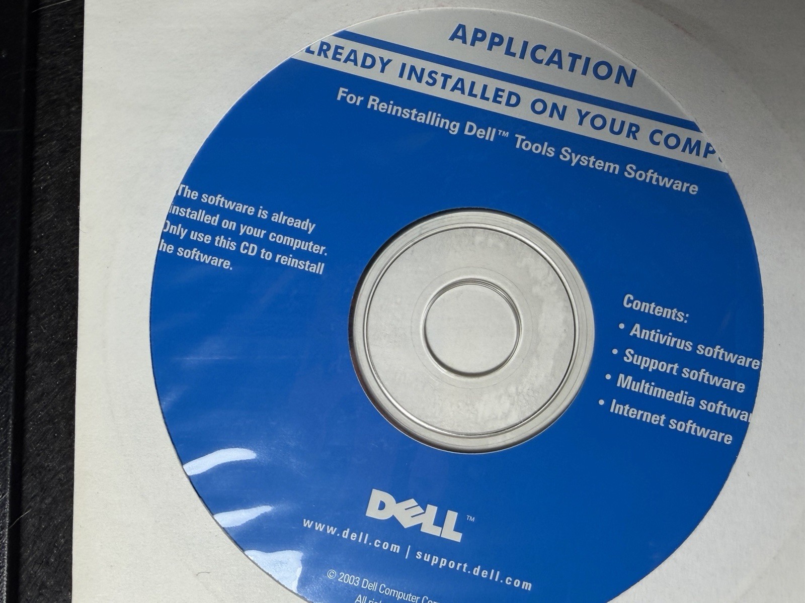 three vintage Dell reinstall CDs