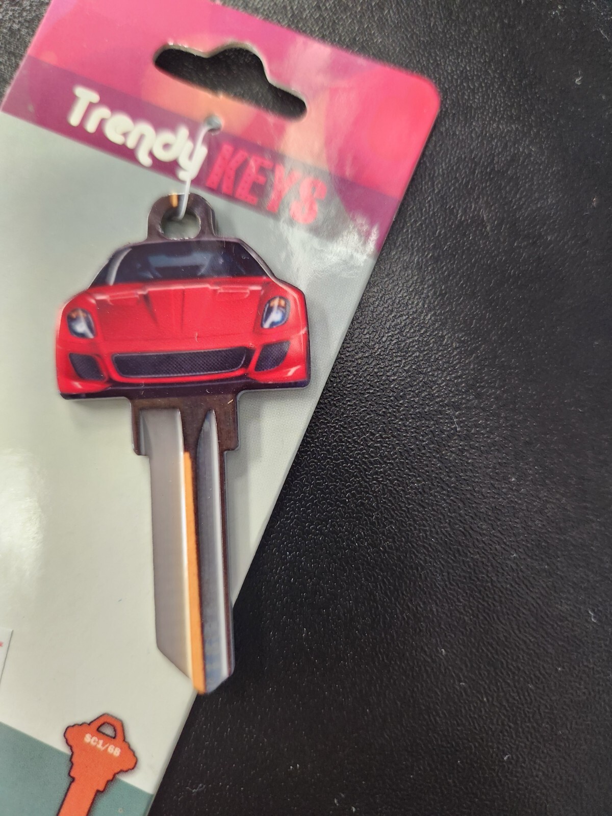 RED SPORTY CAR SHAPED SCHLAGE SC1 KEYBLANK - READ DETAILS BELOW