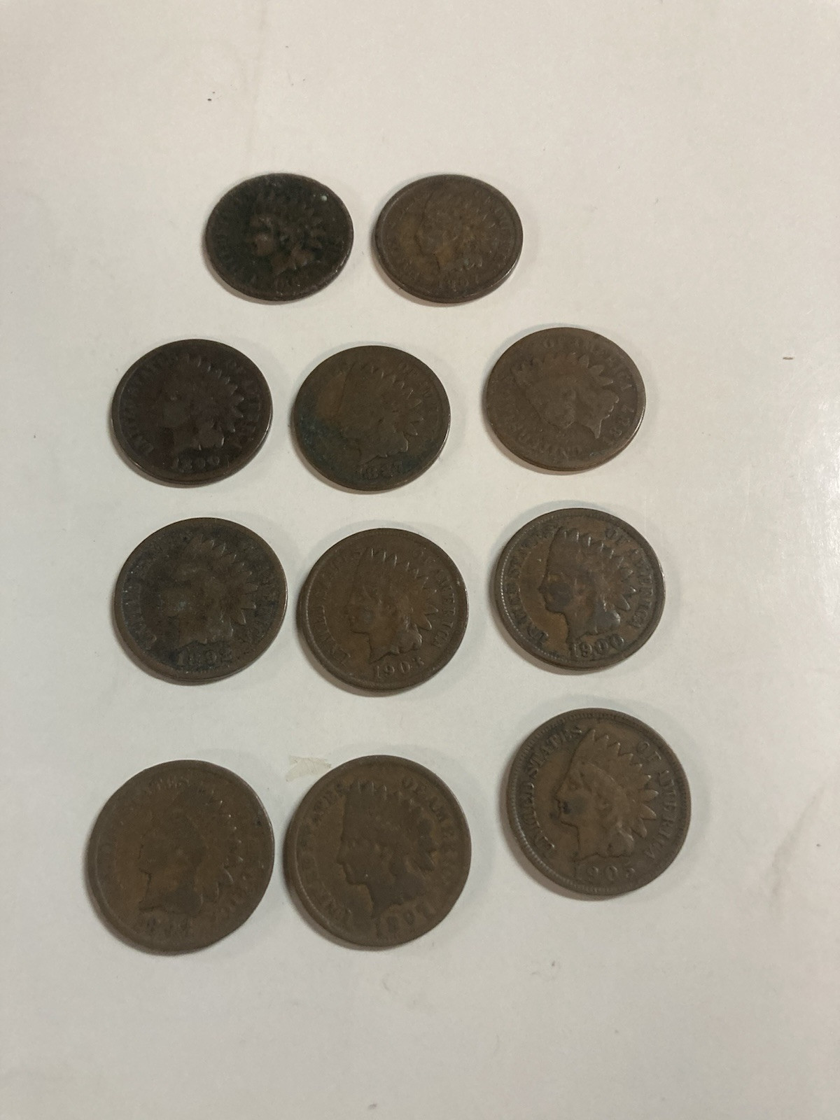 11 copper Indian head pennies 1865-1907 all legible