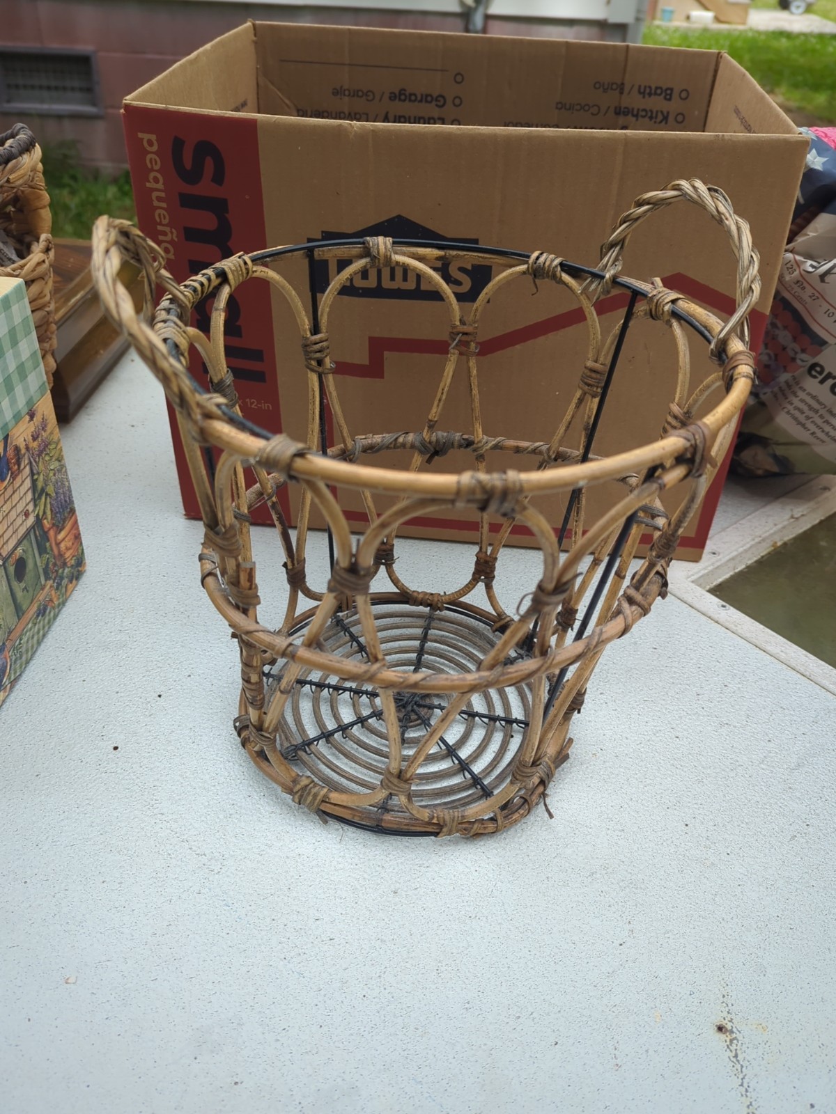 boho chic bamboo or rattan wastebasket or planter featuring earthy textures.