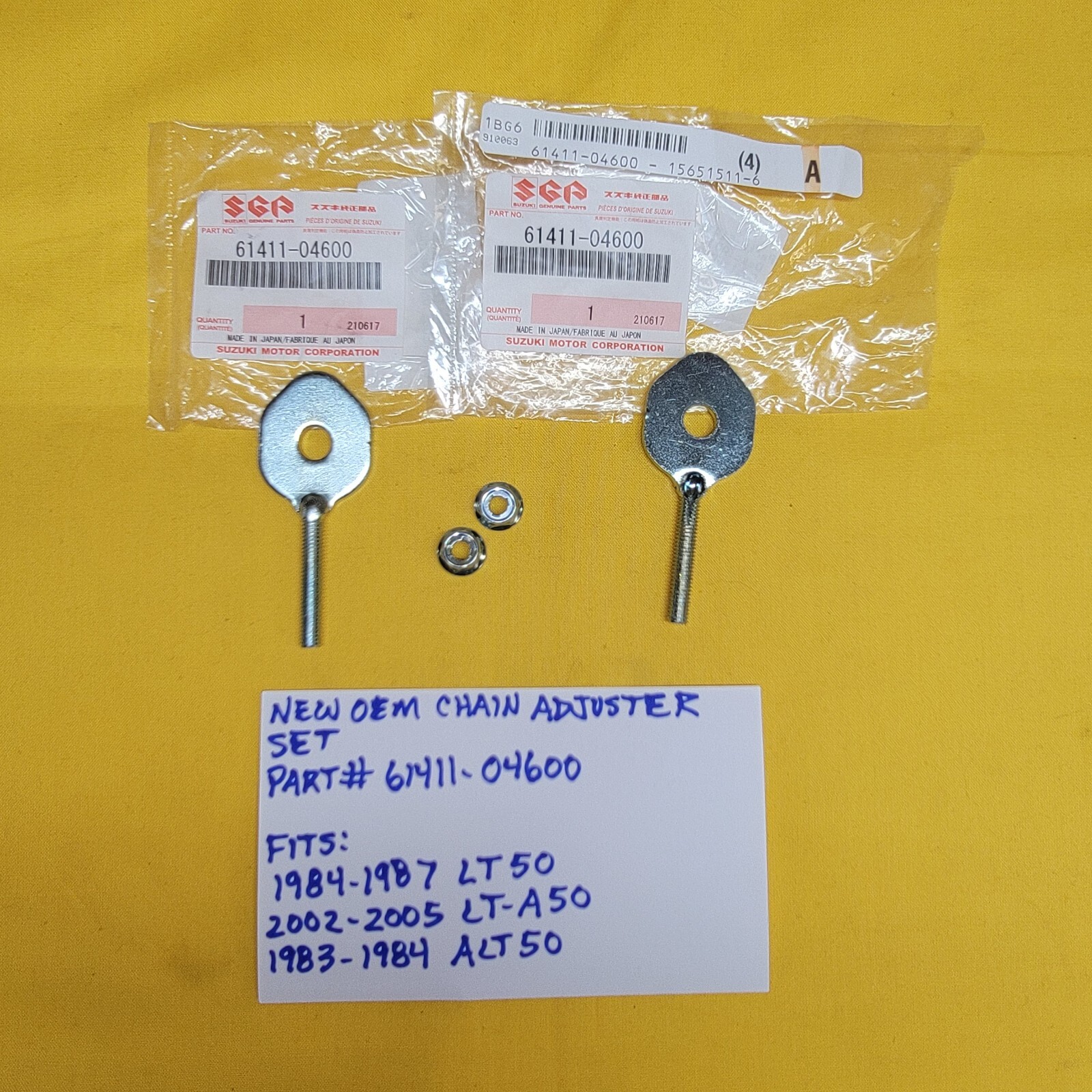 NEW OEM Suzuki Chain Adjuster Set 61411-04600 84-87 LT50 02-05 LT-A50 83-84ALT50