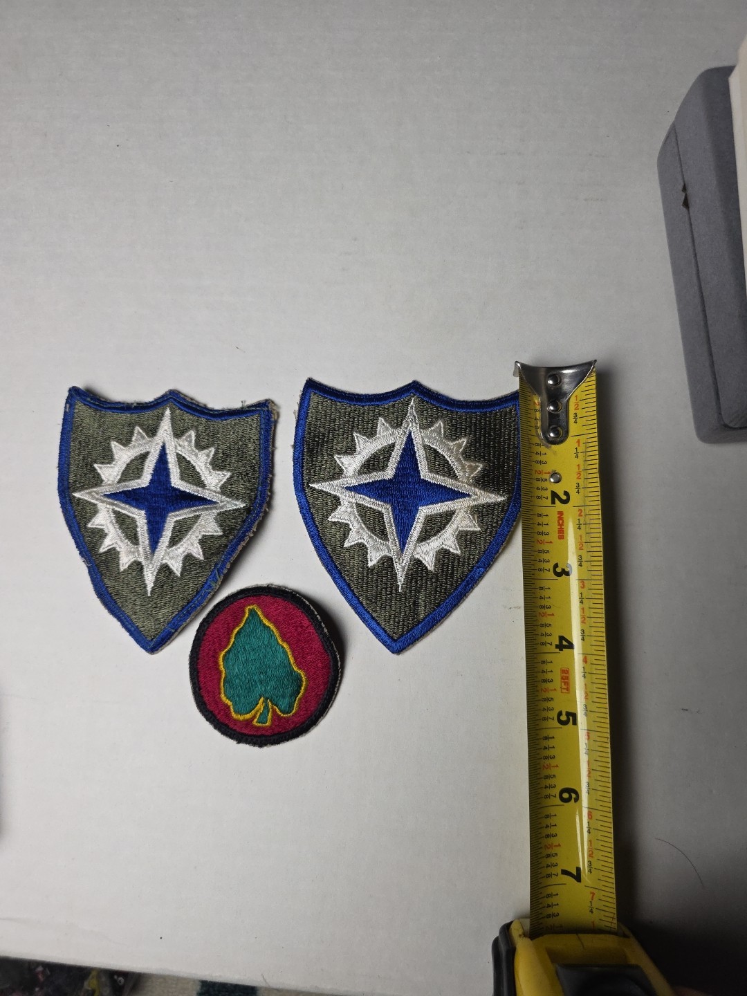 U.S. Army XVI Corps (16th Army Corps) patches, from the World War II era. 1945