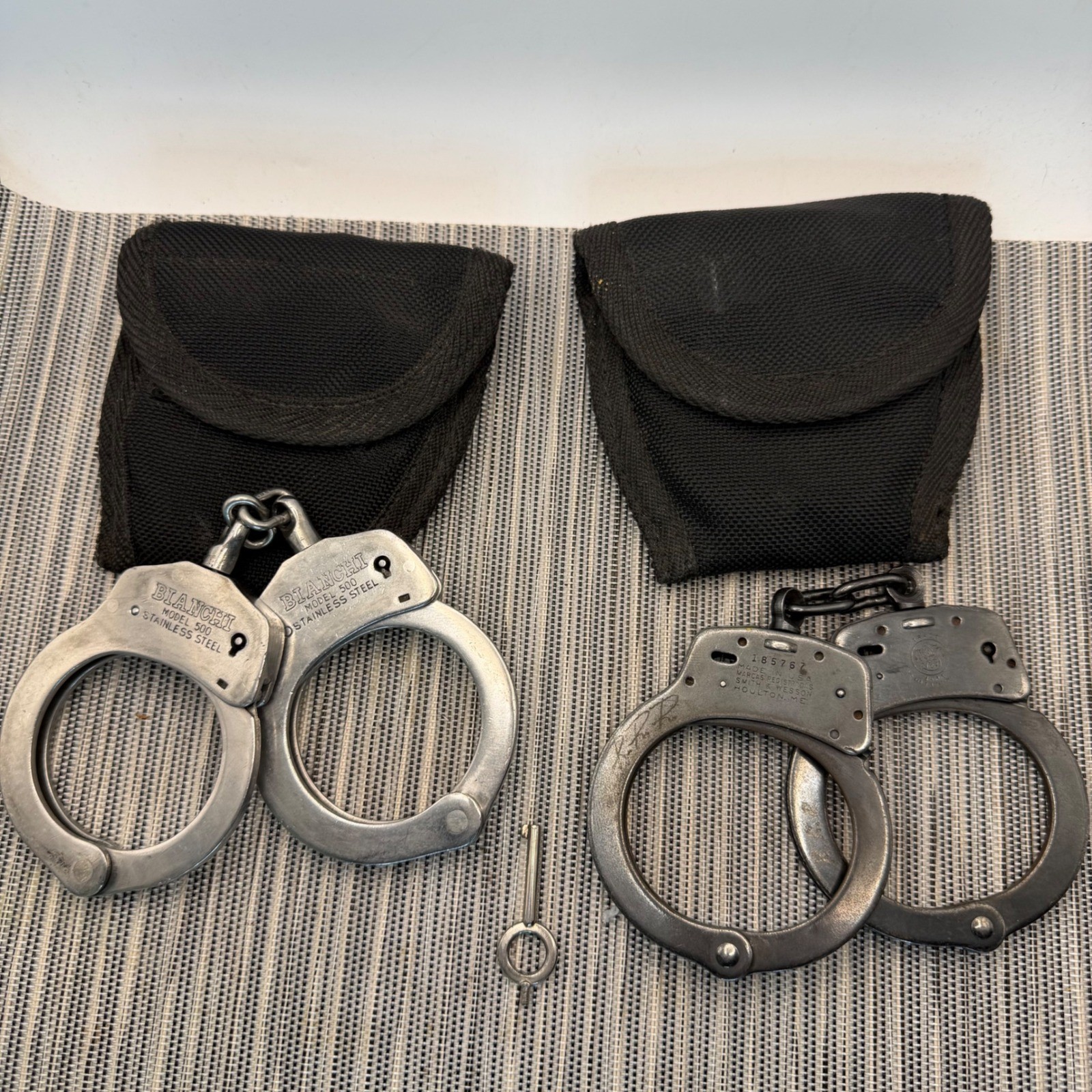 Bianchi 500 Stainless & Smith Wesson M-100 Handcuffs with Aker Pouches and Key