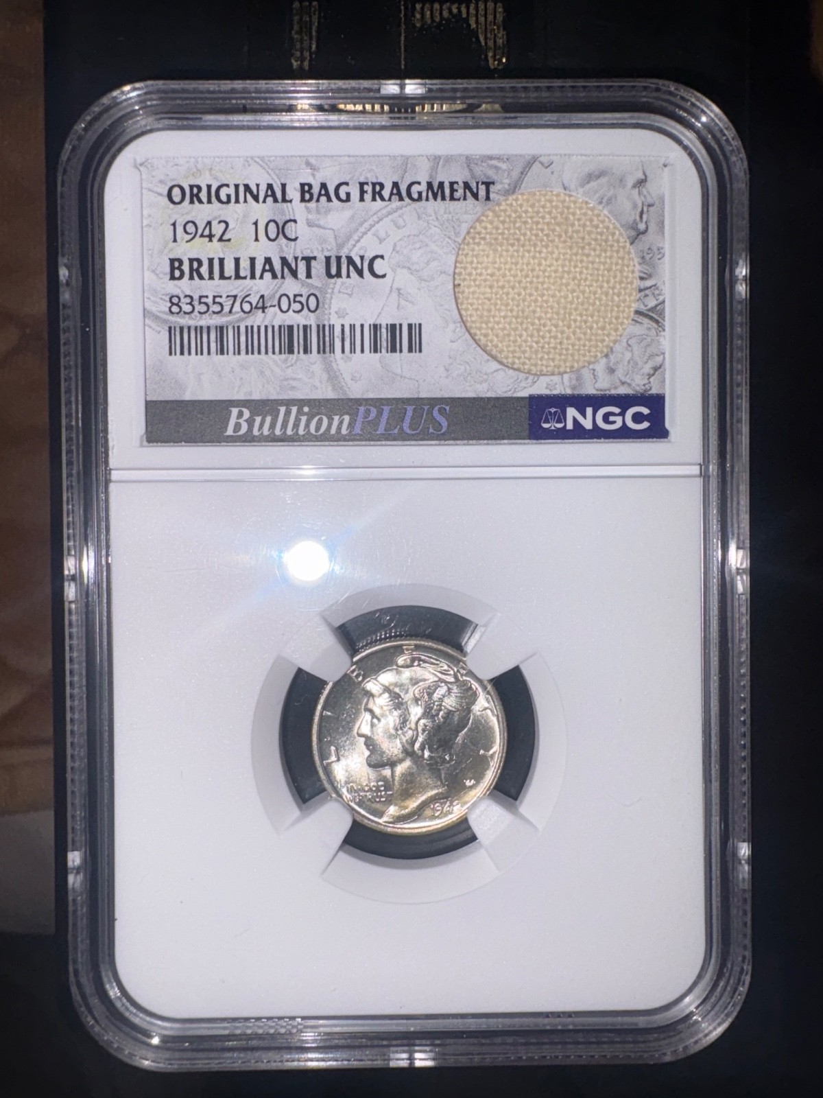 1942 Mercury Dime NGC Brilliant UNC with Original Bag Fragment -056