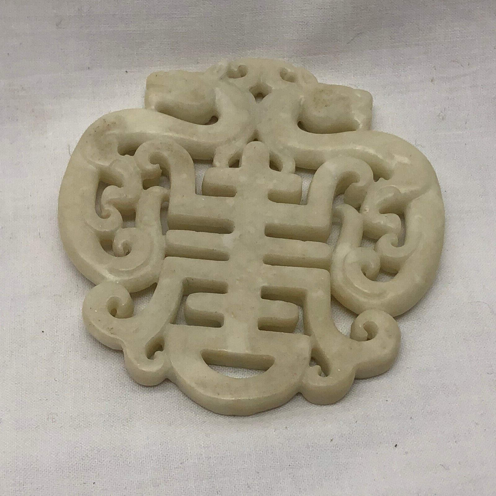 Dragon carved asian stone pendant