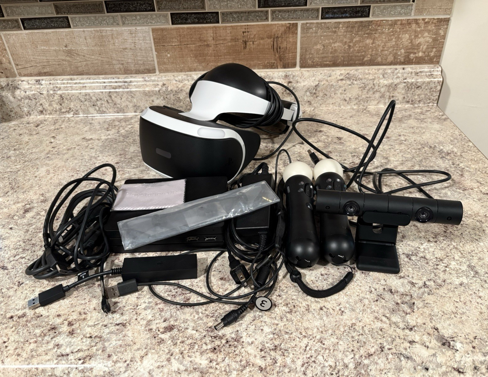 PSVR w/ Camera, Move Controllers, Microfiber Cloth, and Sony Earbuds