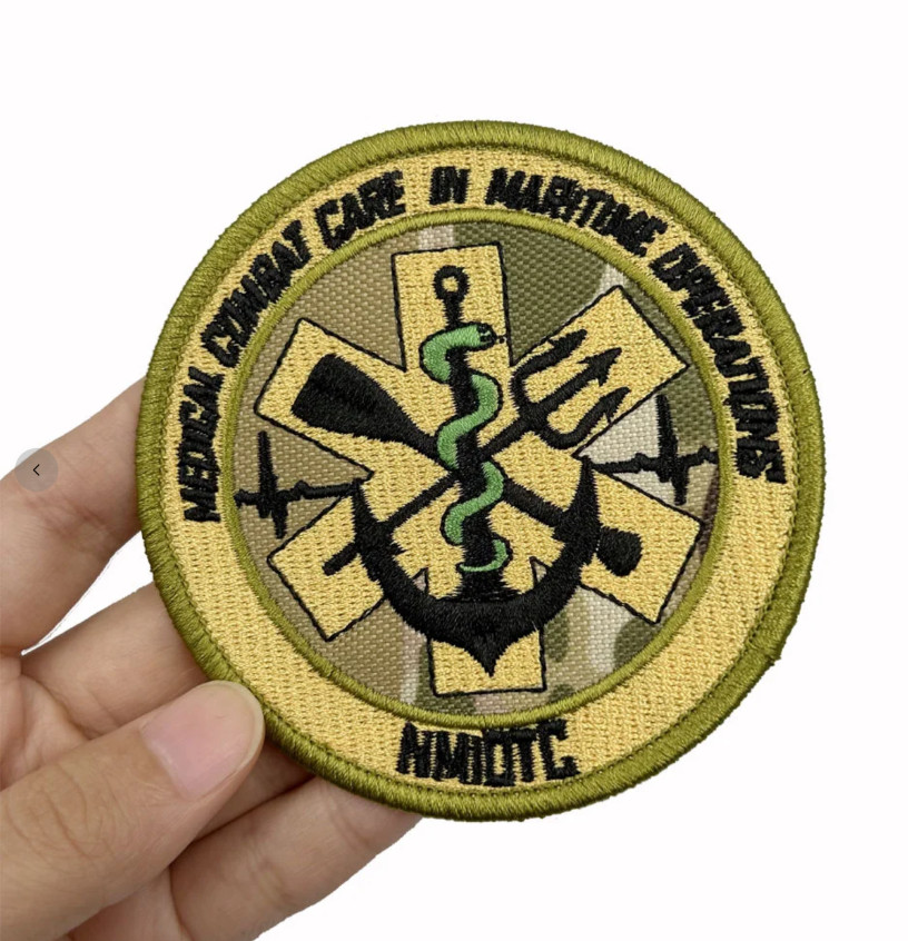 MEDICAL COMBAT CARE IN MARITIME OPERATIONS NMIOTC NATO EMBROIDERED IRON-ON PATCH