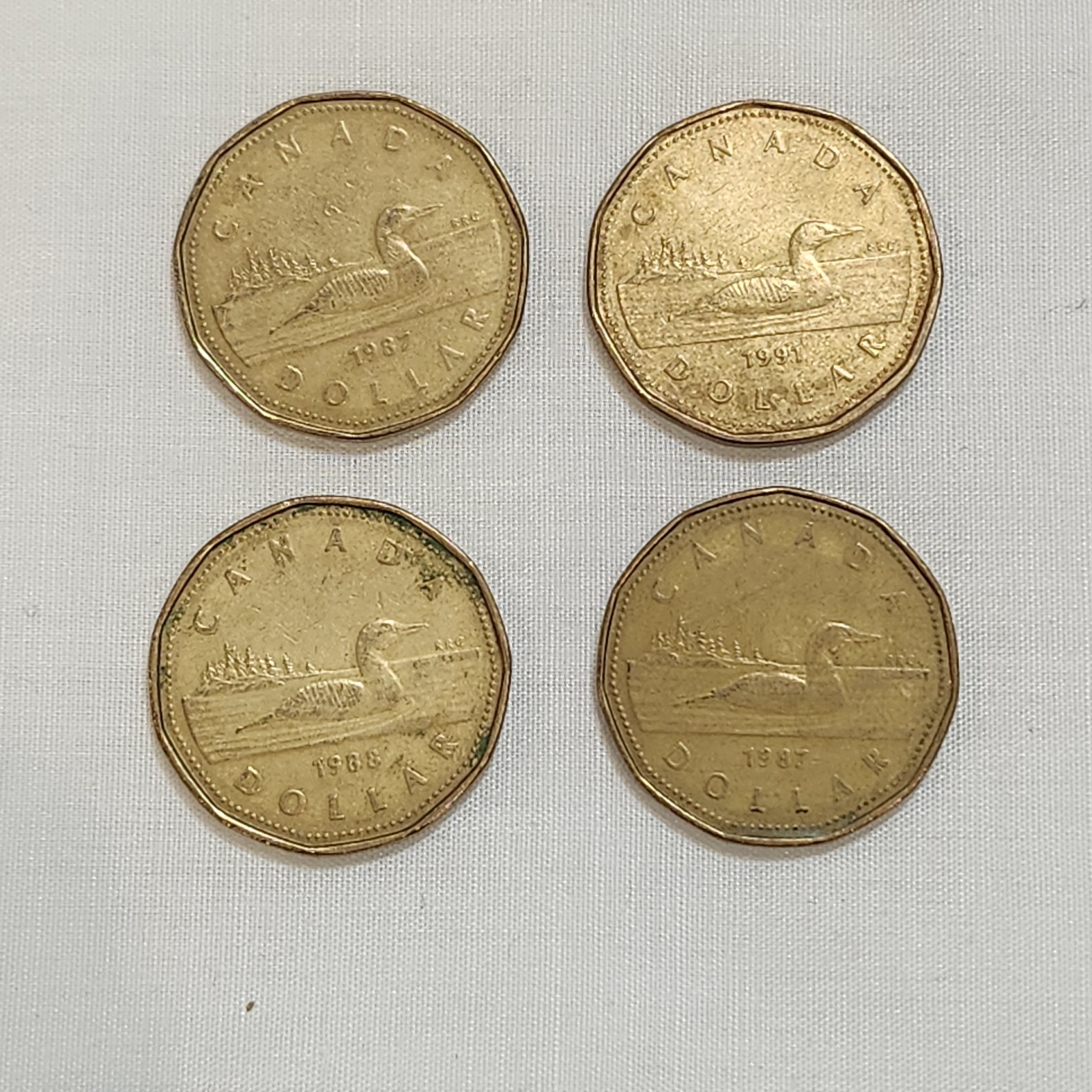 Lot of 4 Canada Loonies 1987 1987 1988 1991 $1 One Dollar Canadian Coins Loony