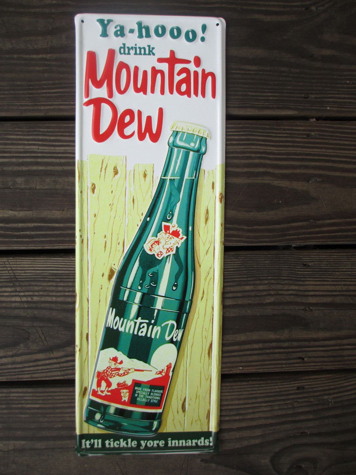 Mountain Dew Steel Sign Bottle on Fence Background Green 19.5 x 6 Inches Retro