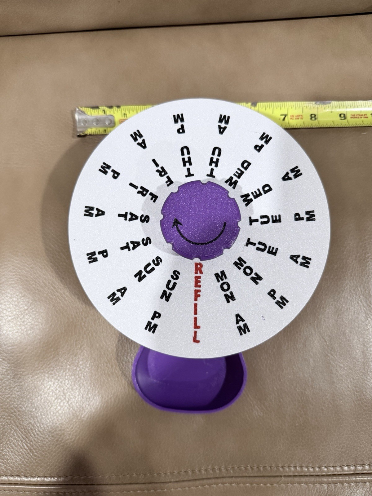 3D-printed 7 In pill organizer wheel designed to track medication dosages Purple