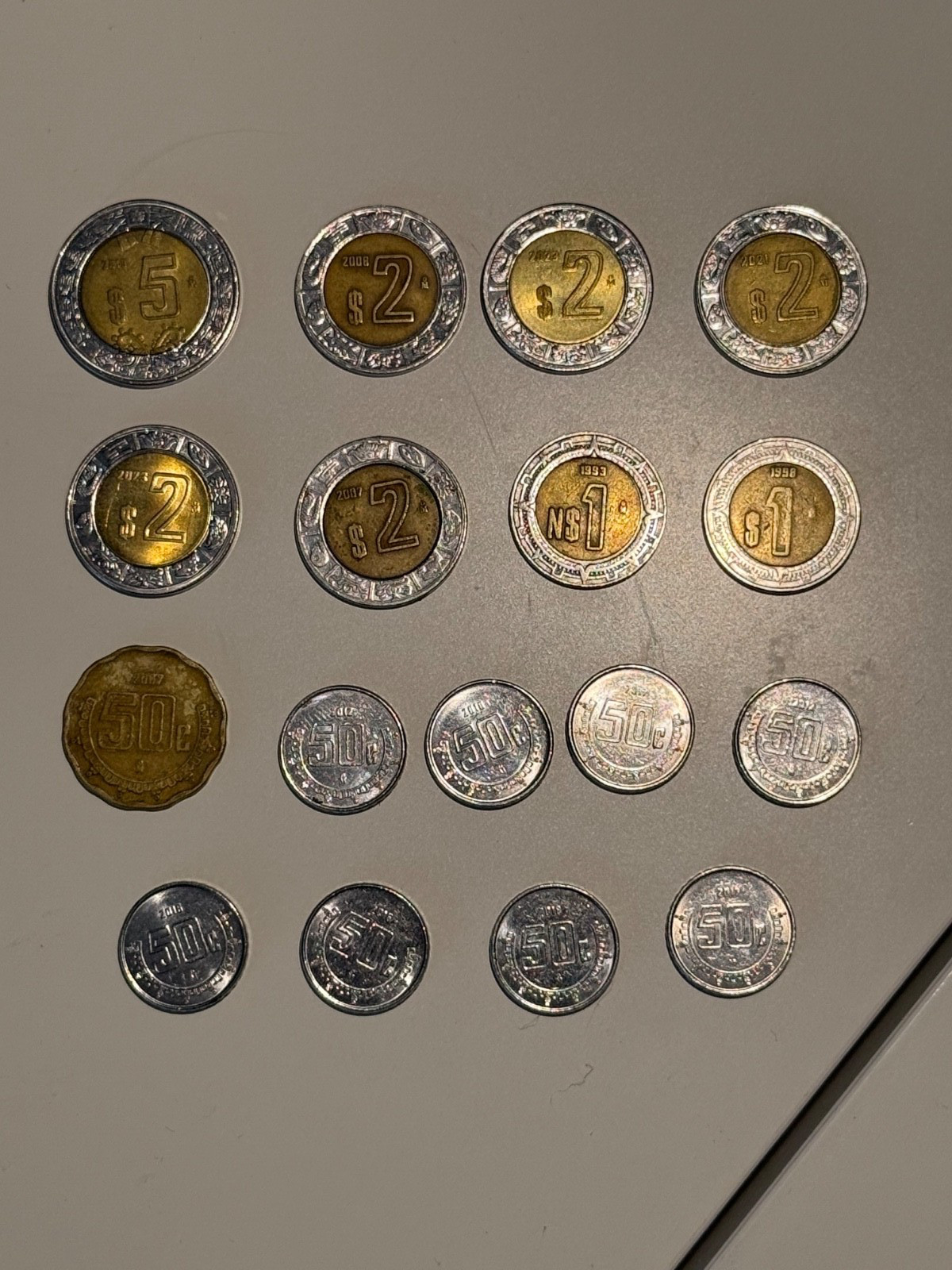 Lot of Mexican Bi-Metal Pesos and 50 centavos coins with bonus 10 centavos