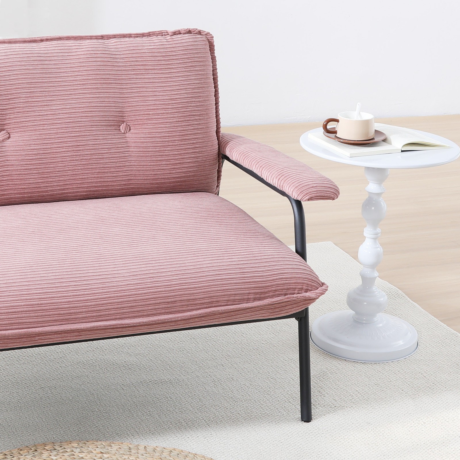 The 53-inch pink sofa offers a spacious layout in the small apartment, easily