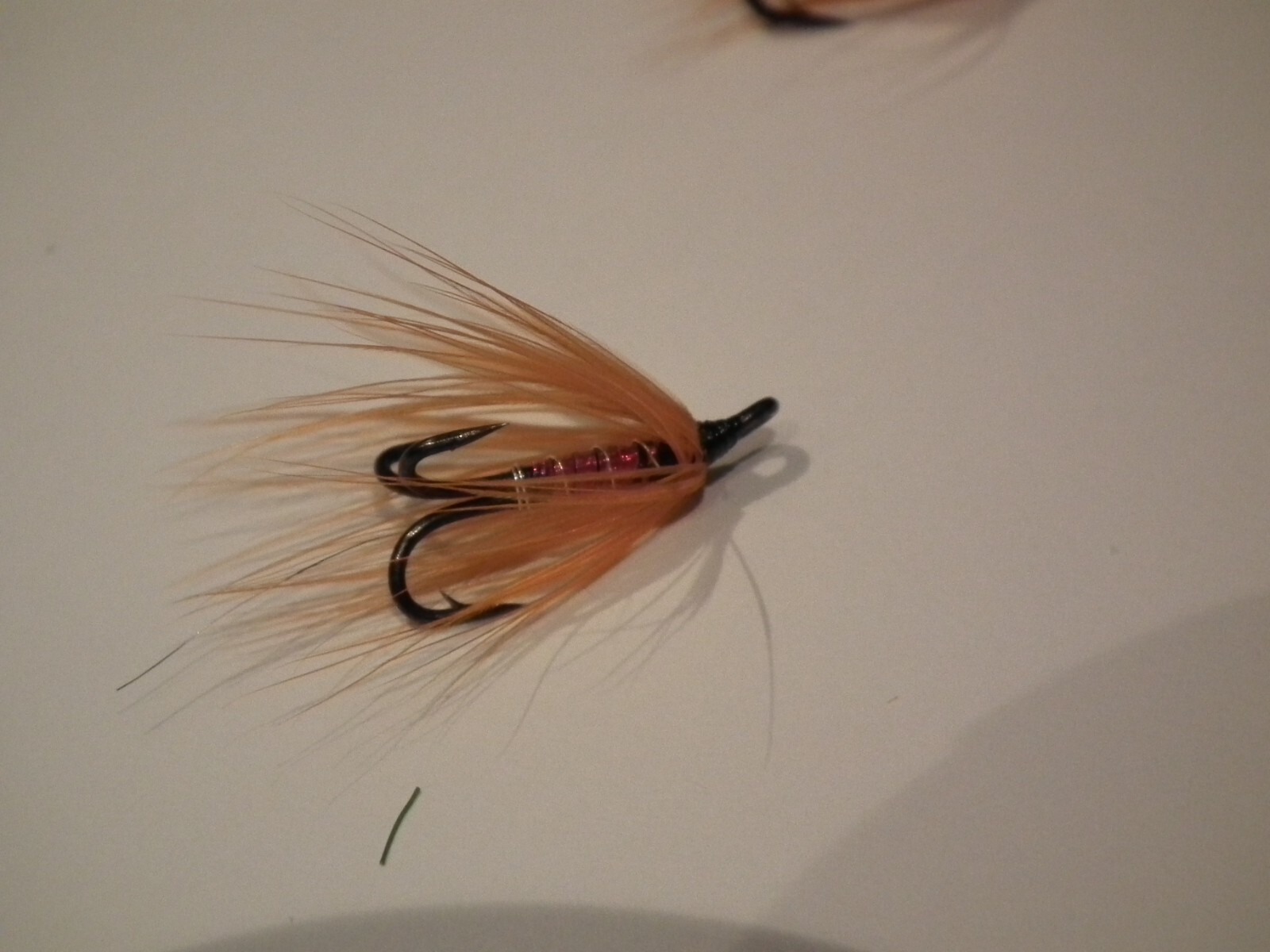 salmon/seatrout fly----1 orange & pink tied on a black size 14 treble