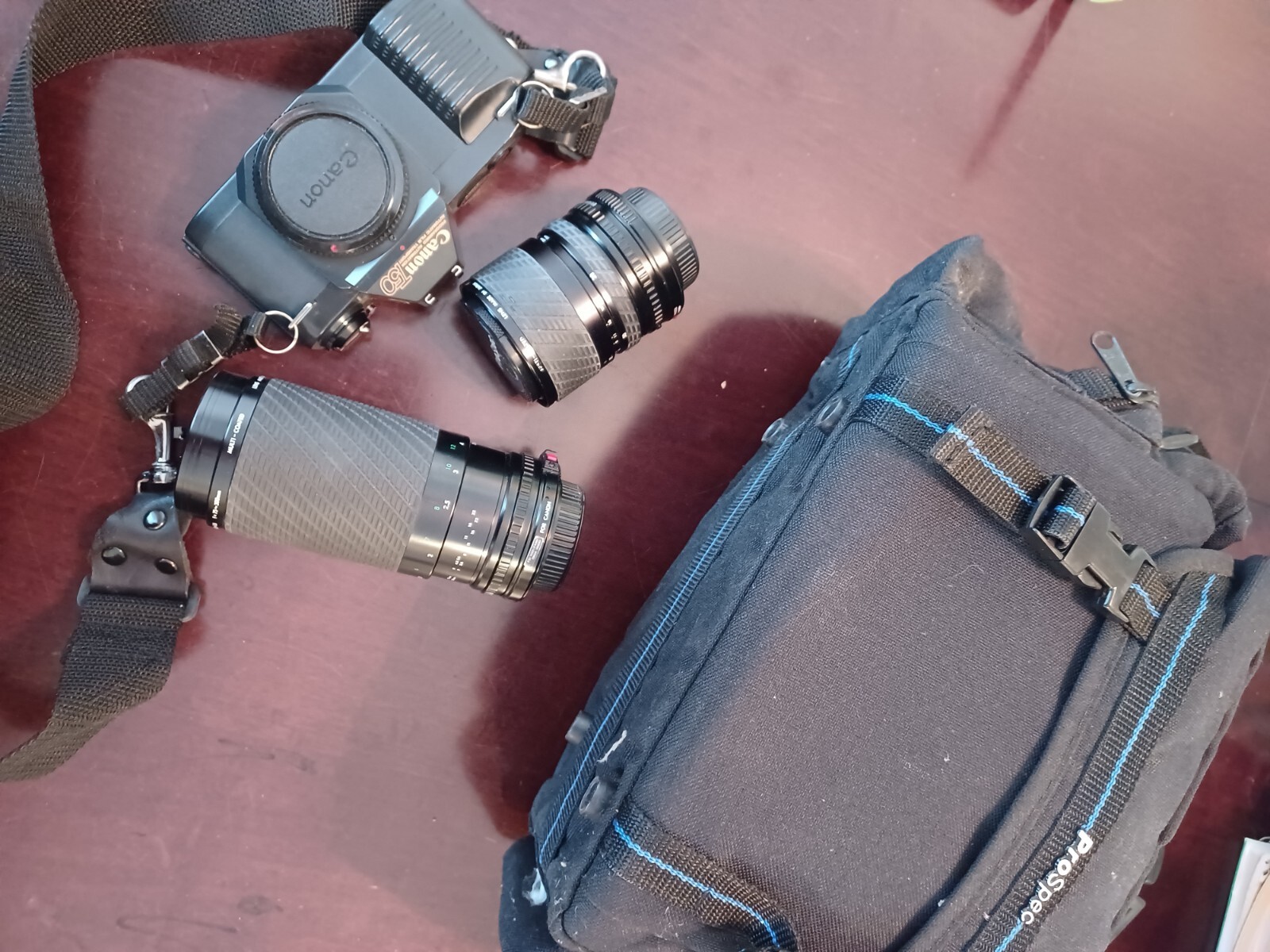  Canon ProSpecT50 35mm camera, two lenses, bag, brush, 